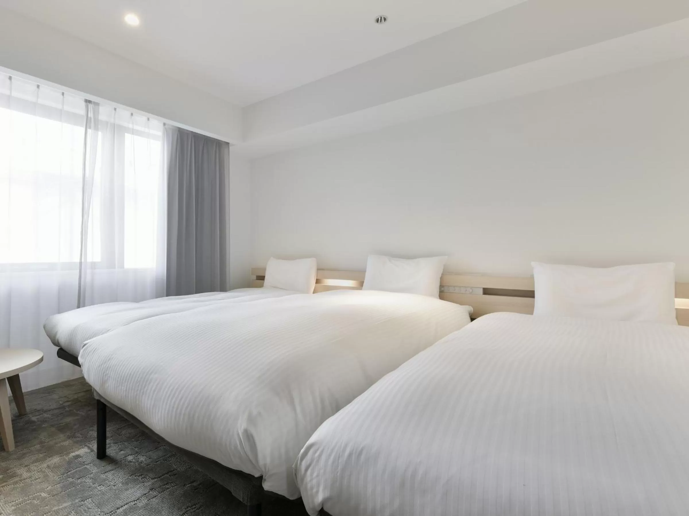 Bed in REF Kumamoto by VESSEL HOTELS
