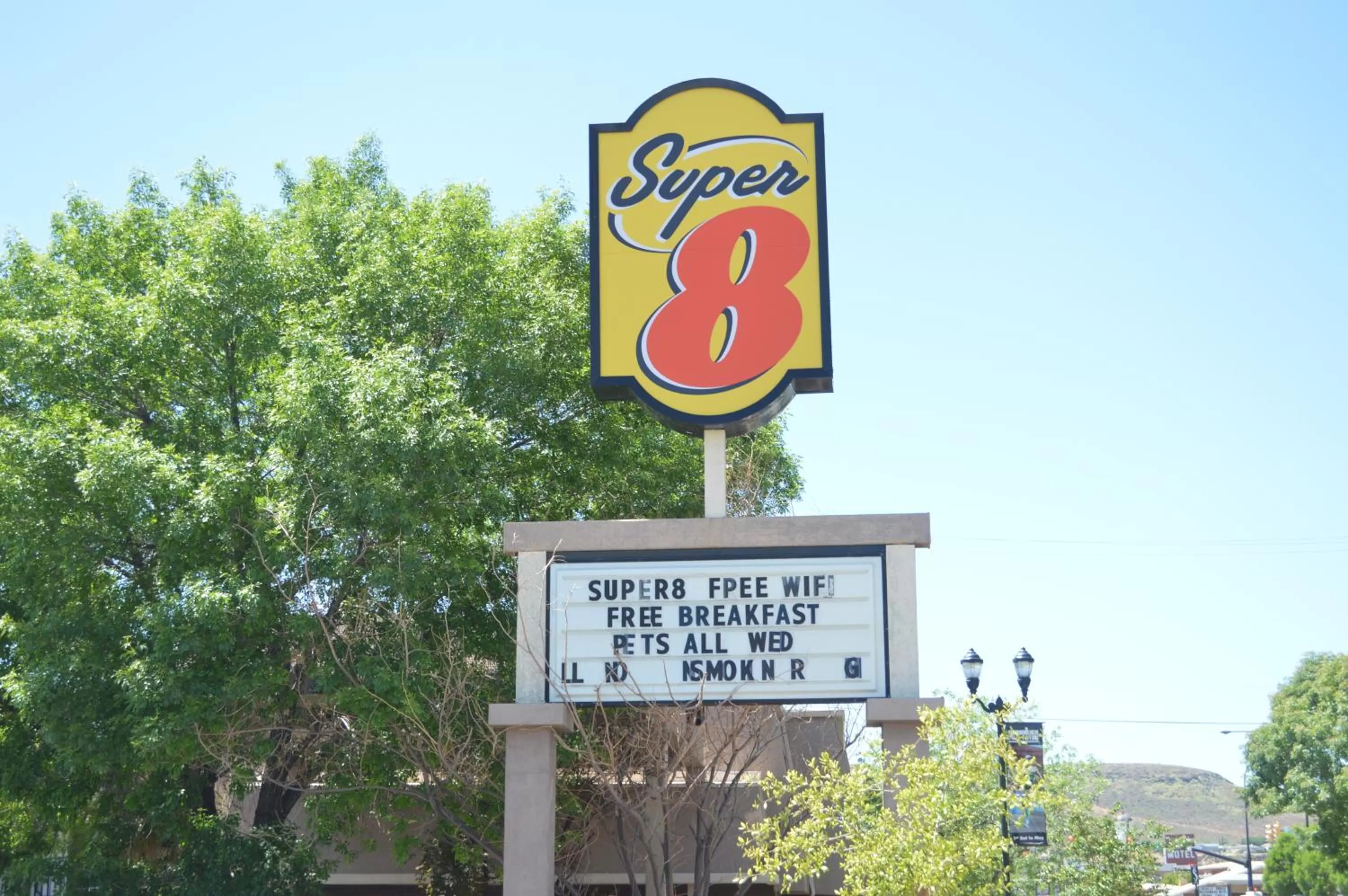 Property logo or sign in Super 8 by Wyndham St. George UT