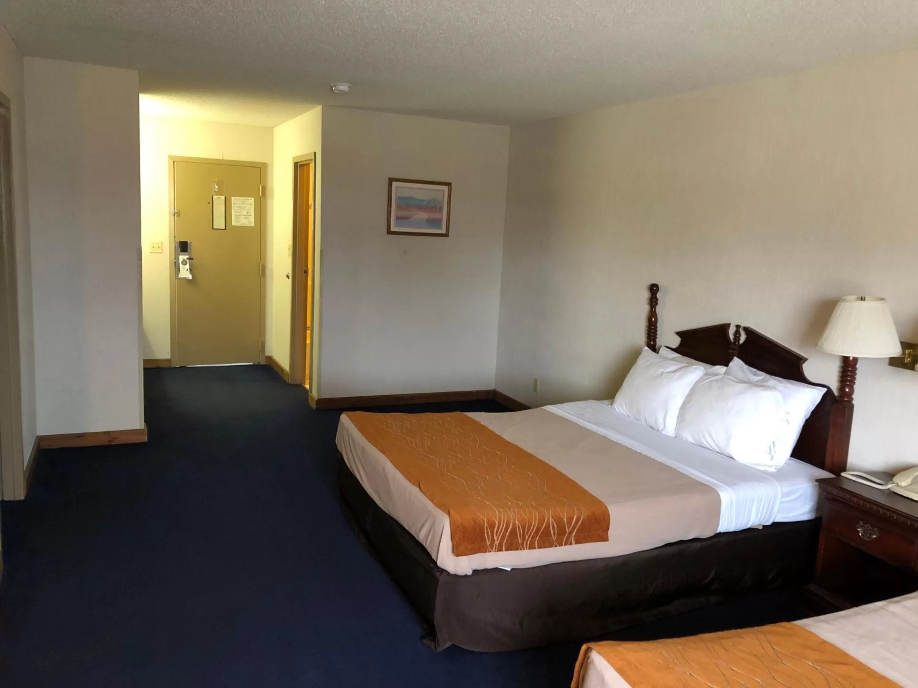 Bedroom in Denison Inn & Suites