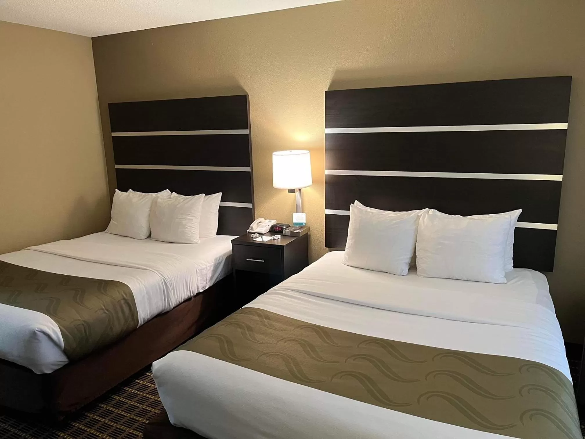 Bed in Quality Inn & Suites