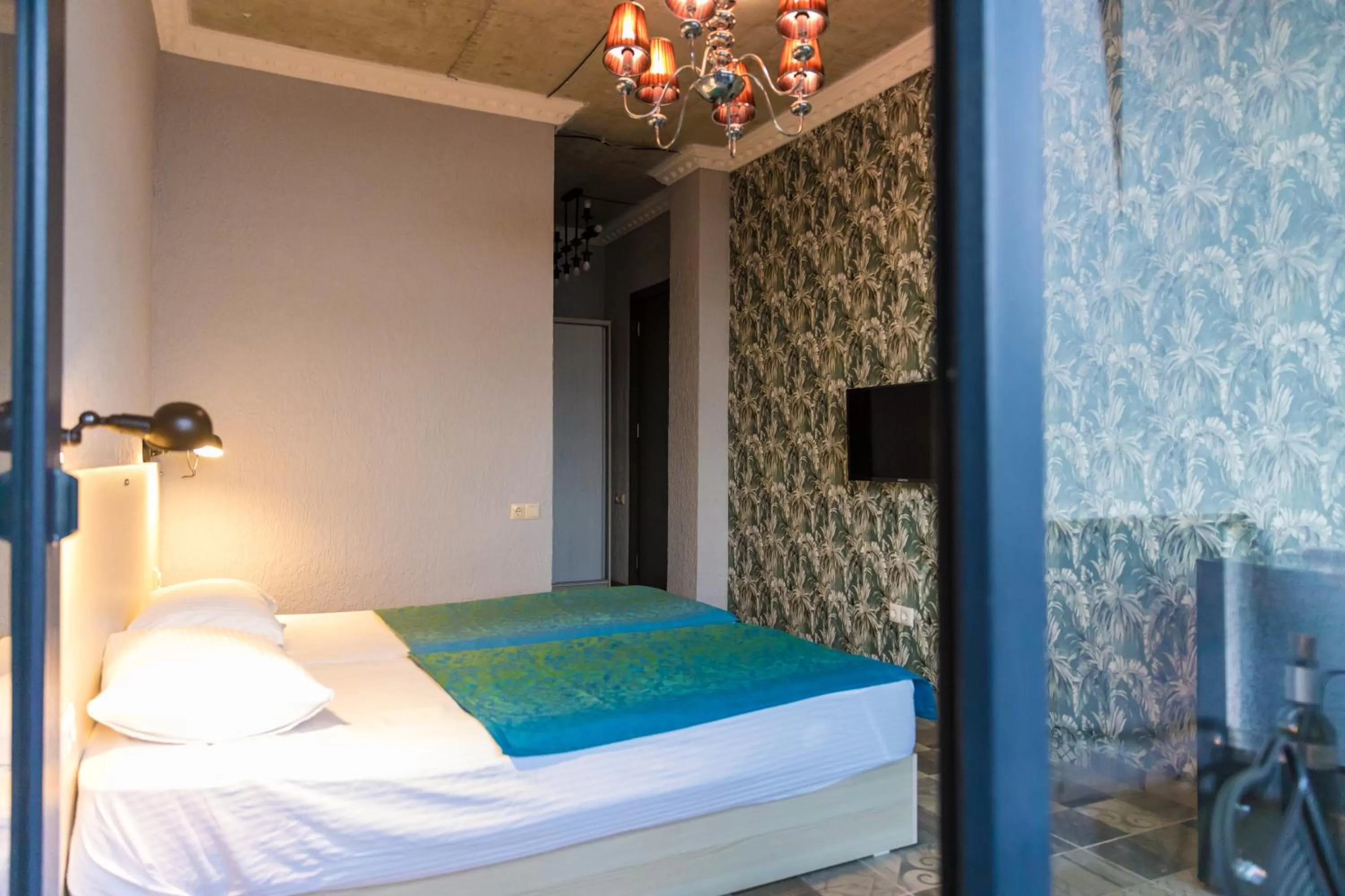 Photo of the whole room, Bed in TJ GARDENS