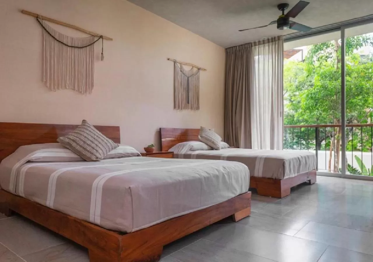 Bed in ARUNA TULUM-Luxury Studios & Apartments
