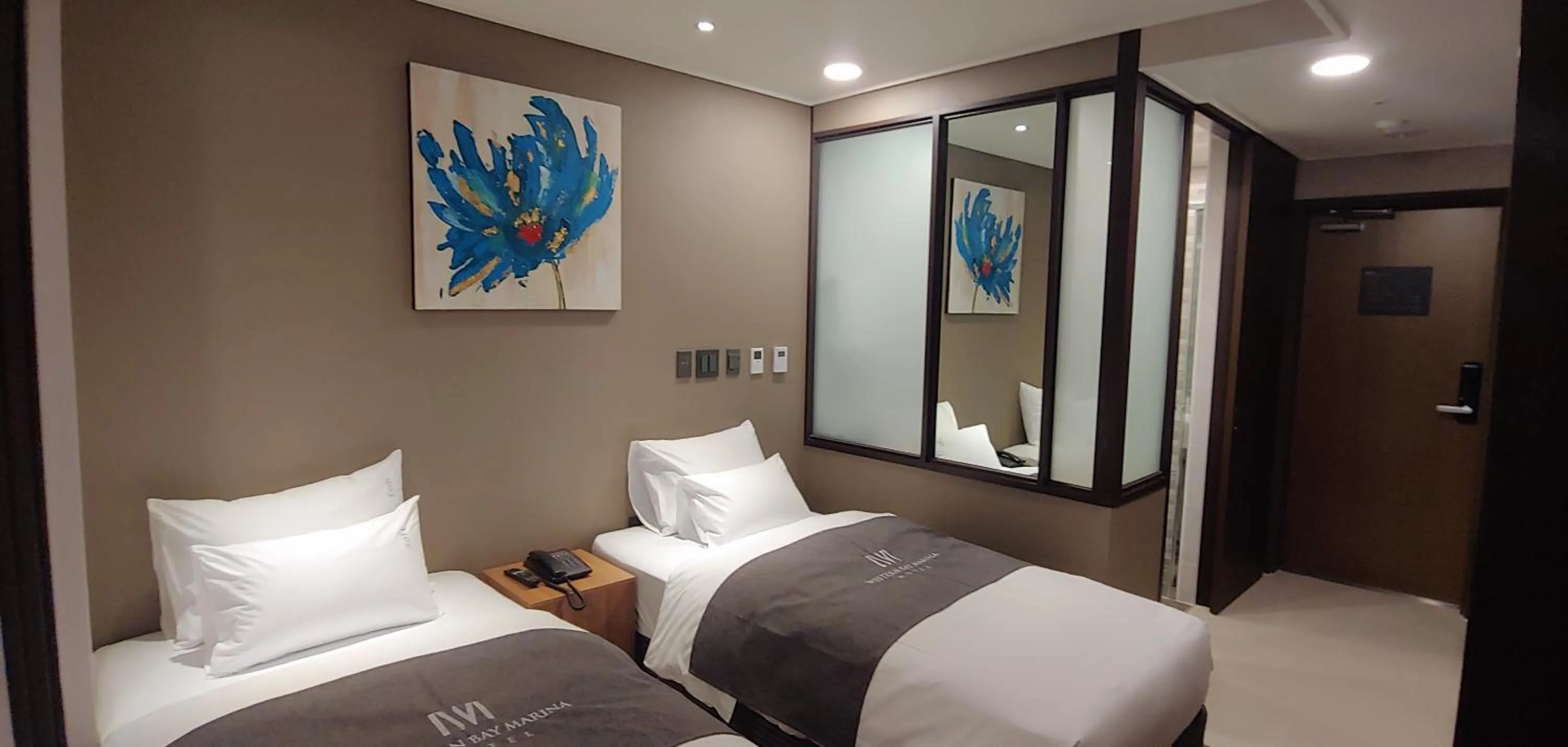 Bed in Western Bay Marina Hotel