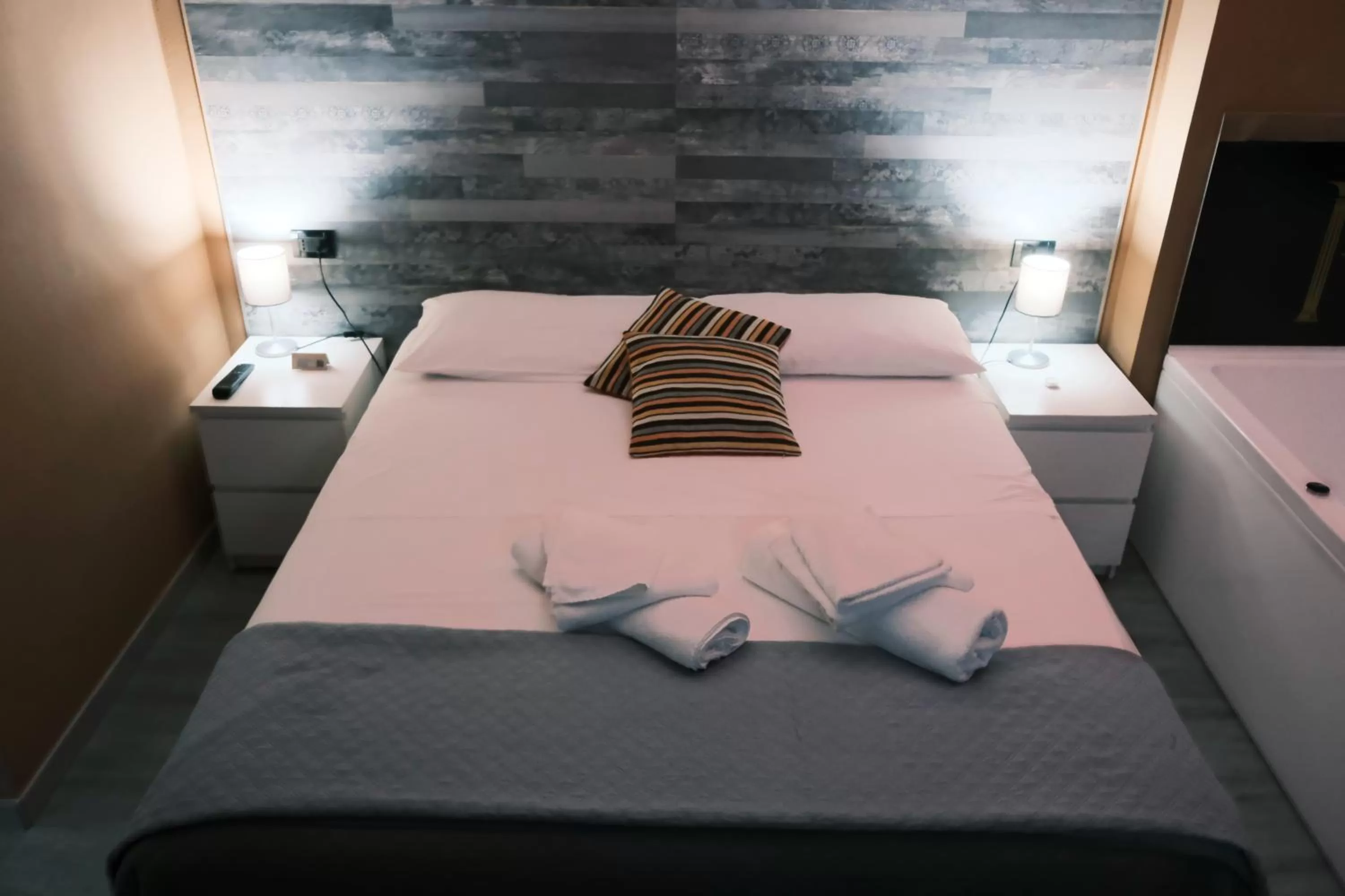 Bed in Royalty Rooms & Spa