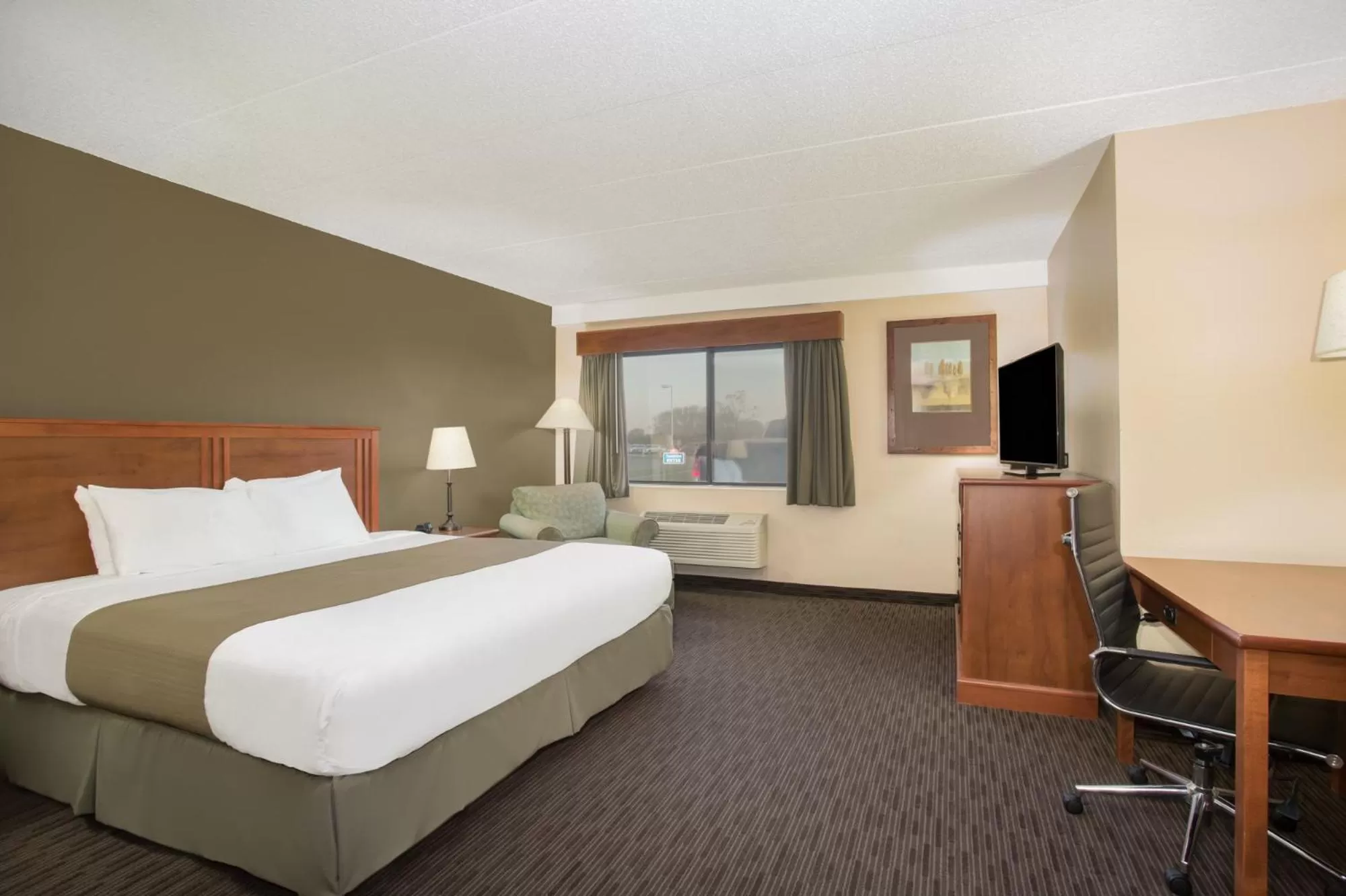 Bed in AmericInn by Wyndham Sioux City