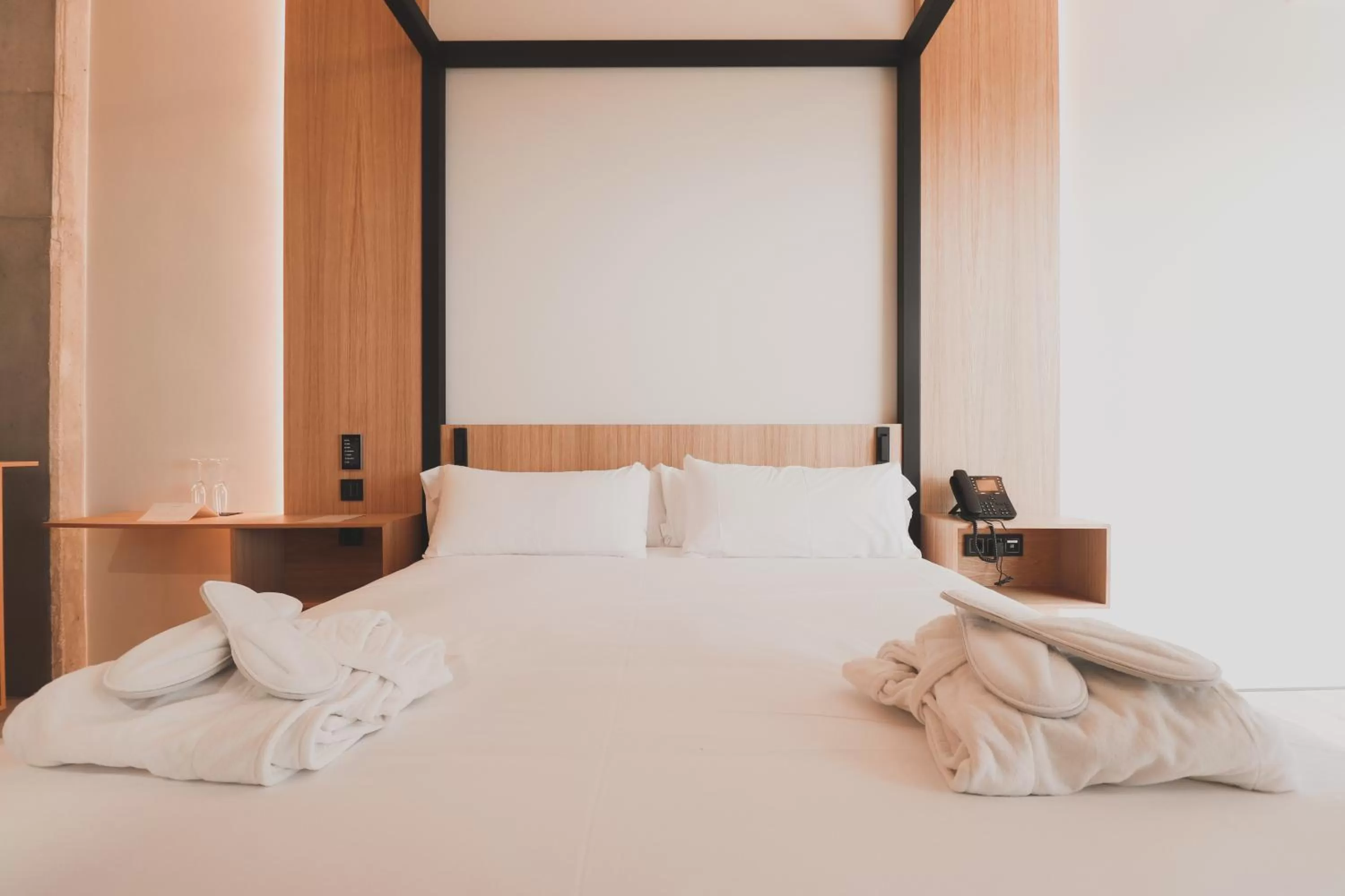 Bed in Atmos Hotel Boutique