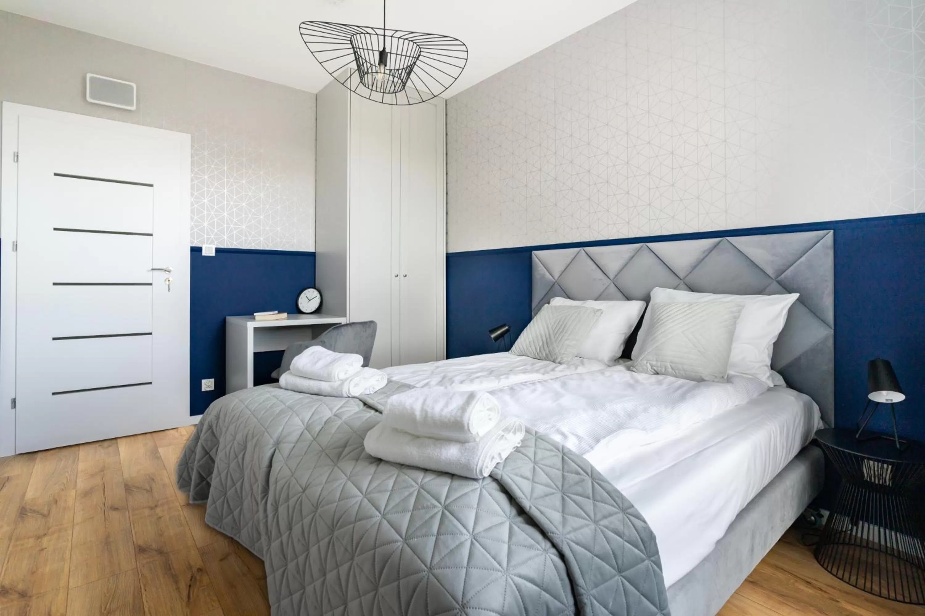 Bed in Symphony Modern Tower Apartamenty