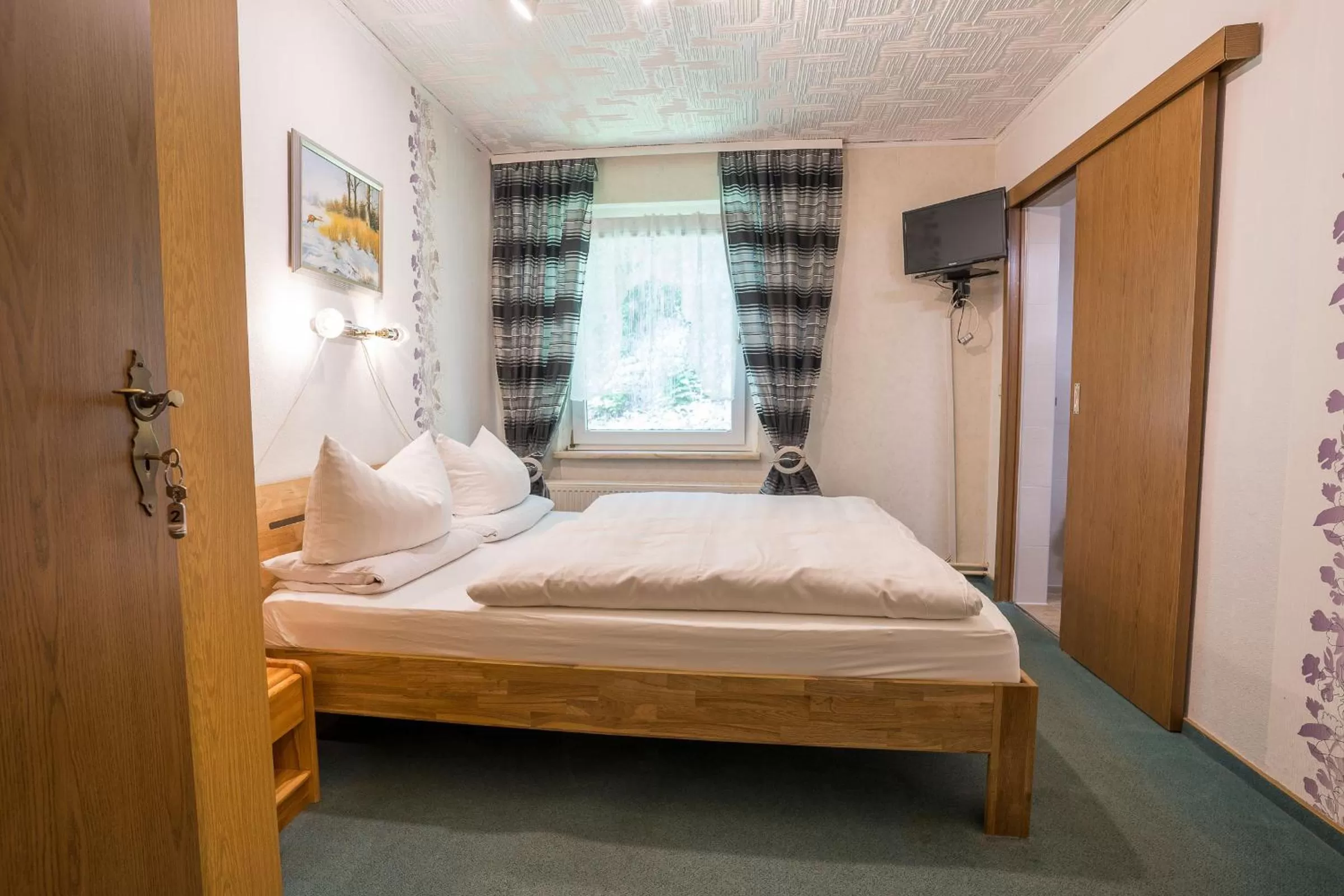 Photo of the whole room, Bed in Waldgaststätte Sennhütte