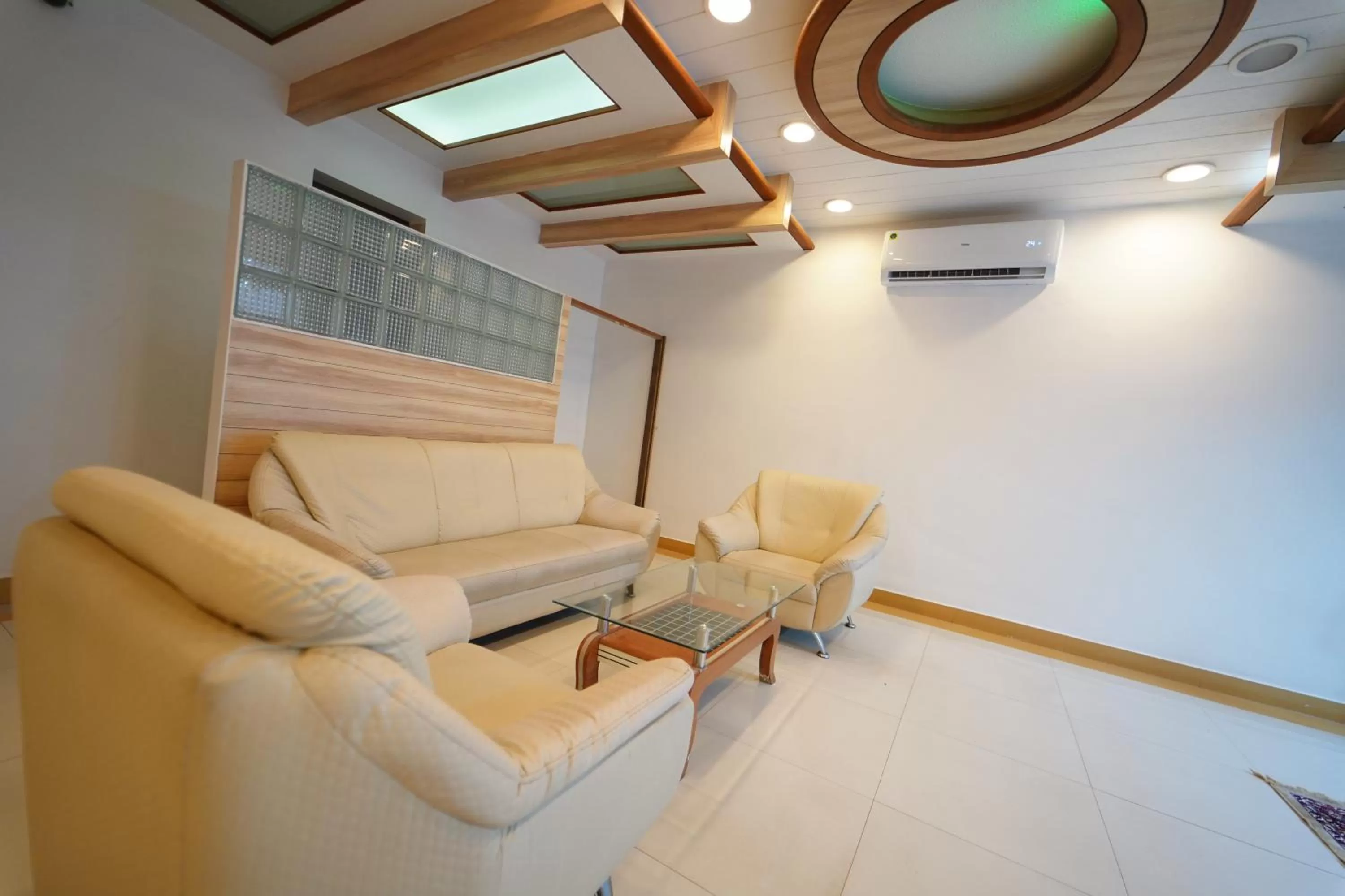 Seating area in Hotel Palmyra Grand Inn