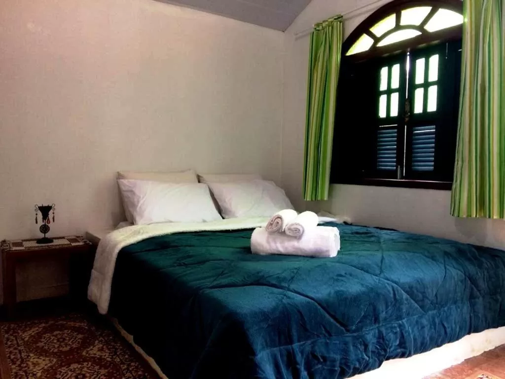 Bed in Pousada Cantinho do Mundo