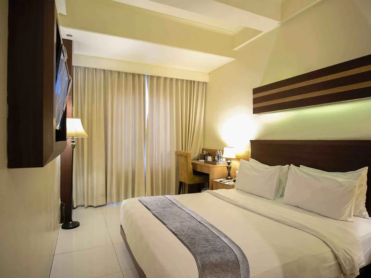 Bed in Sapphire Sky Hotel & Conference