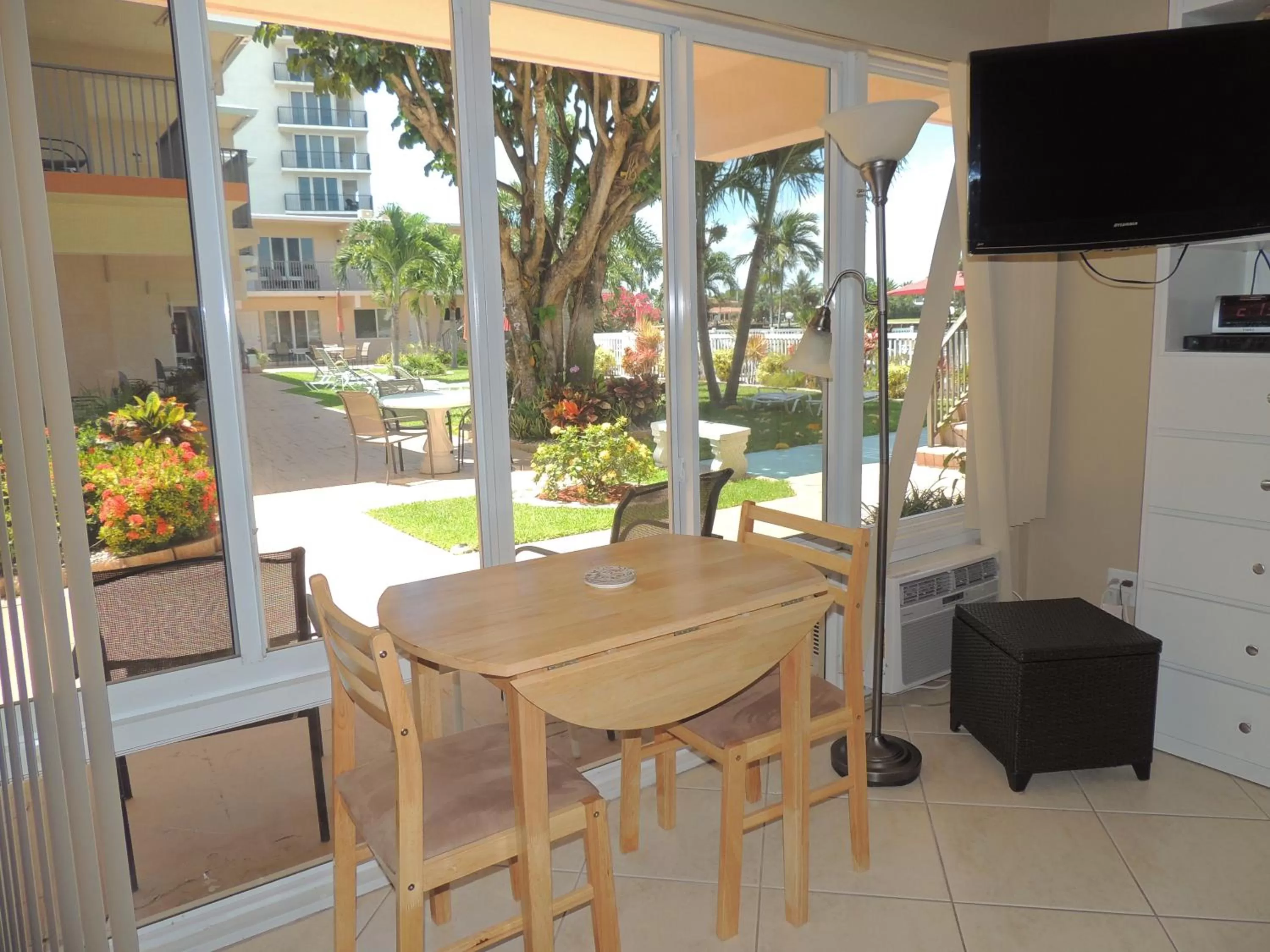 Bed, Dining Area in Aqua Mar Condos