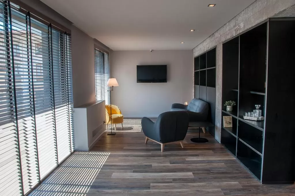 Communal lounge/ TV room in Hotelet de Sant joan