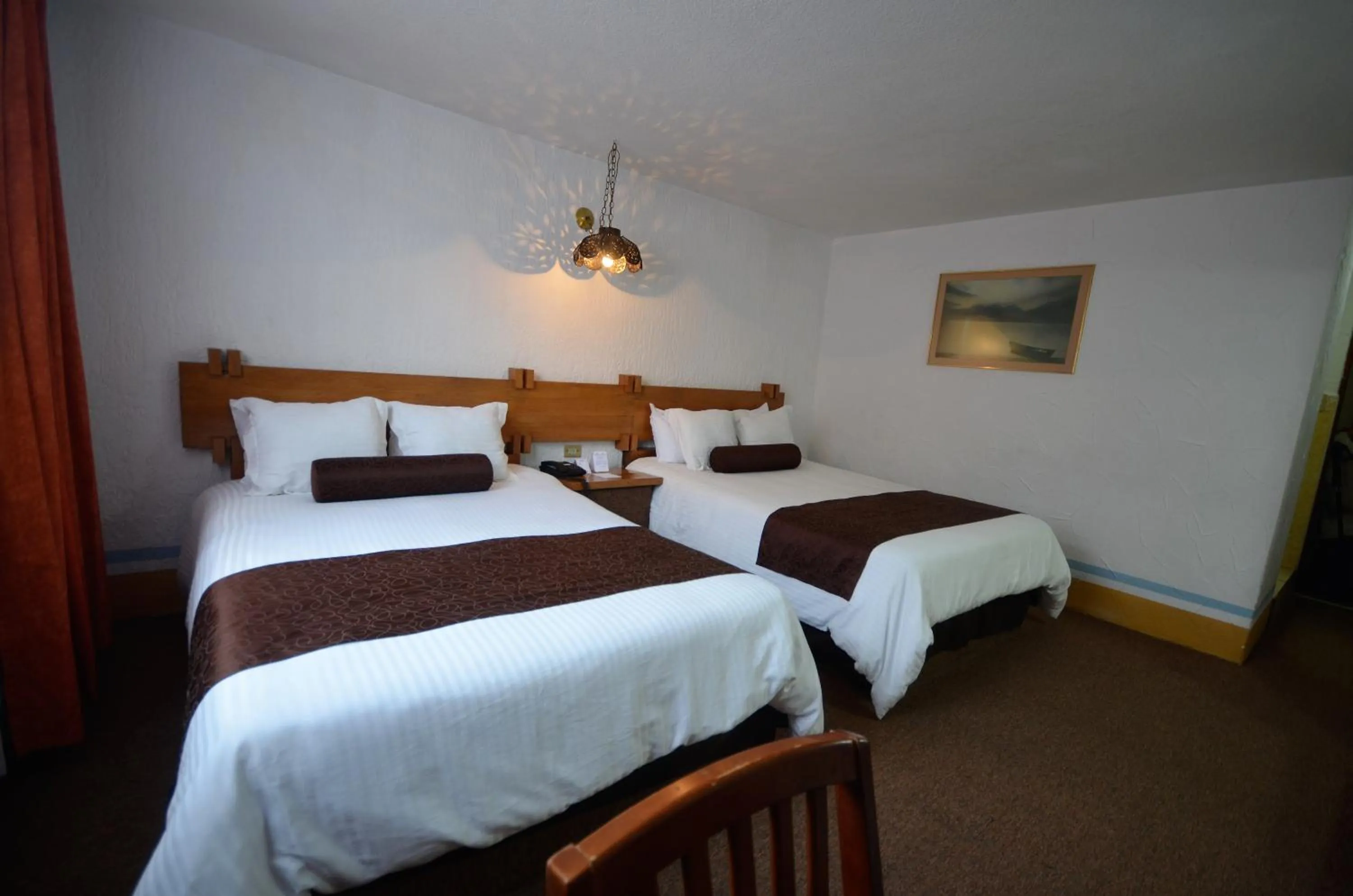 Photo of the whole room, Bed in Howard Johnson by Wyndham Morelia Calle Real