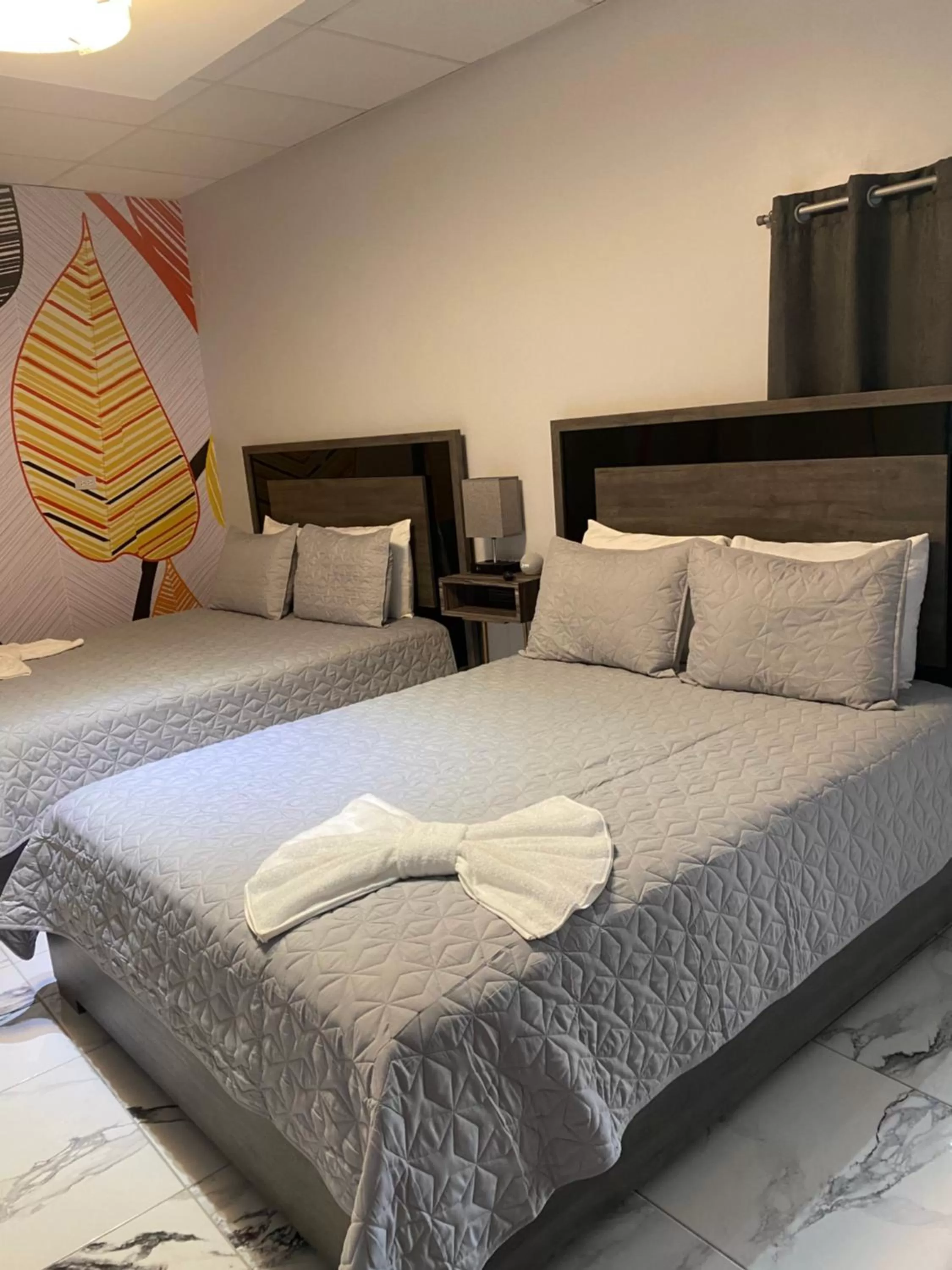 Bed in Itza-Bella Suites