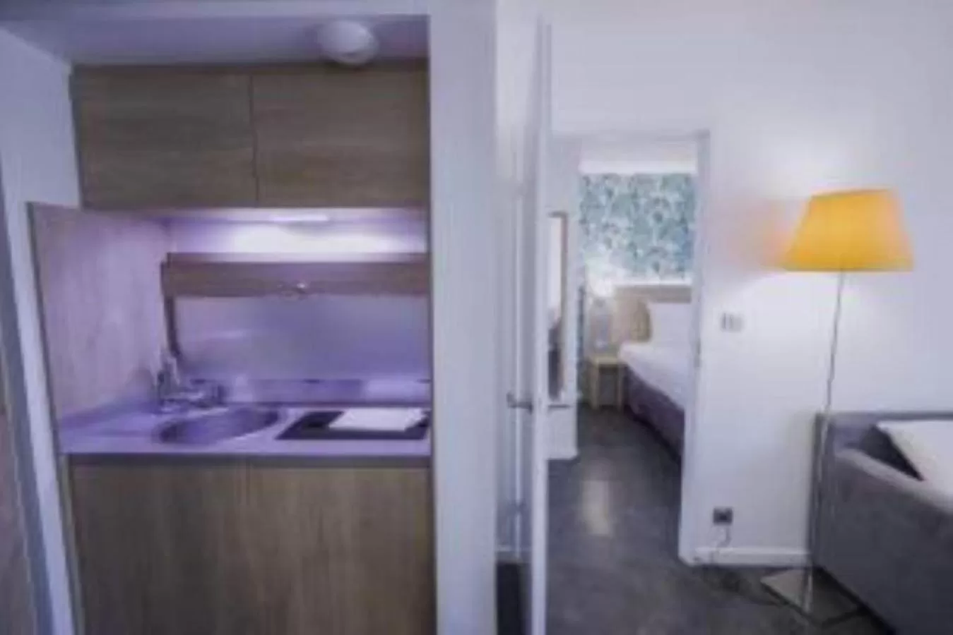 Kitchen or kitchenette, Bed in Best Western Les Aureliades Saint Nazaire