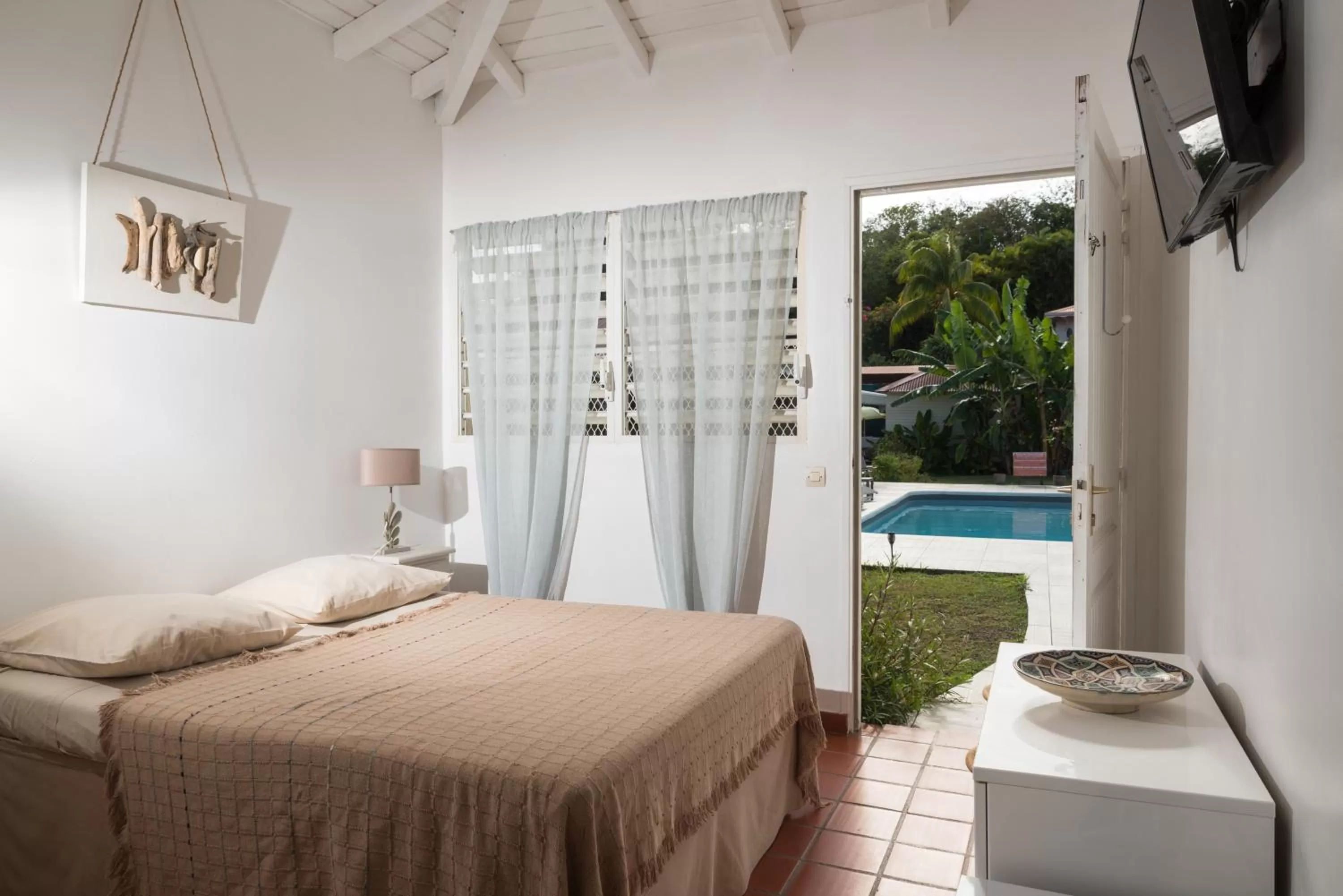 Photo of the whole room, Bed in Hôtel Les Bananiers