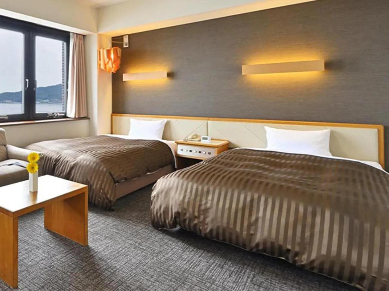 Bed in Miyajima Coral Hotel