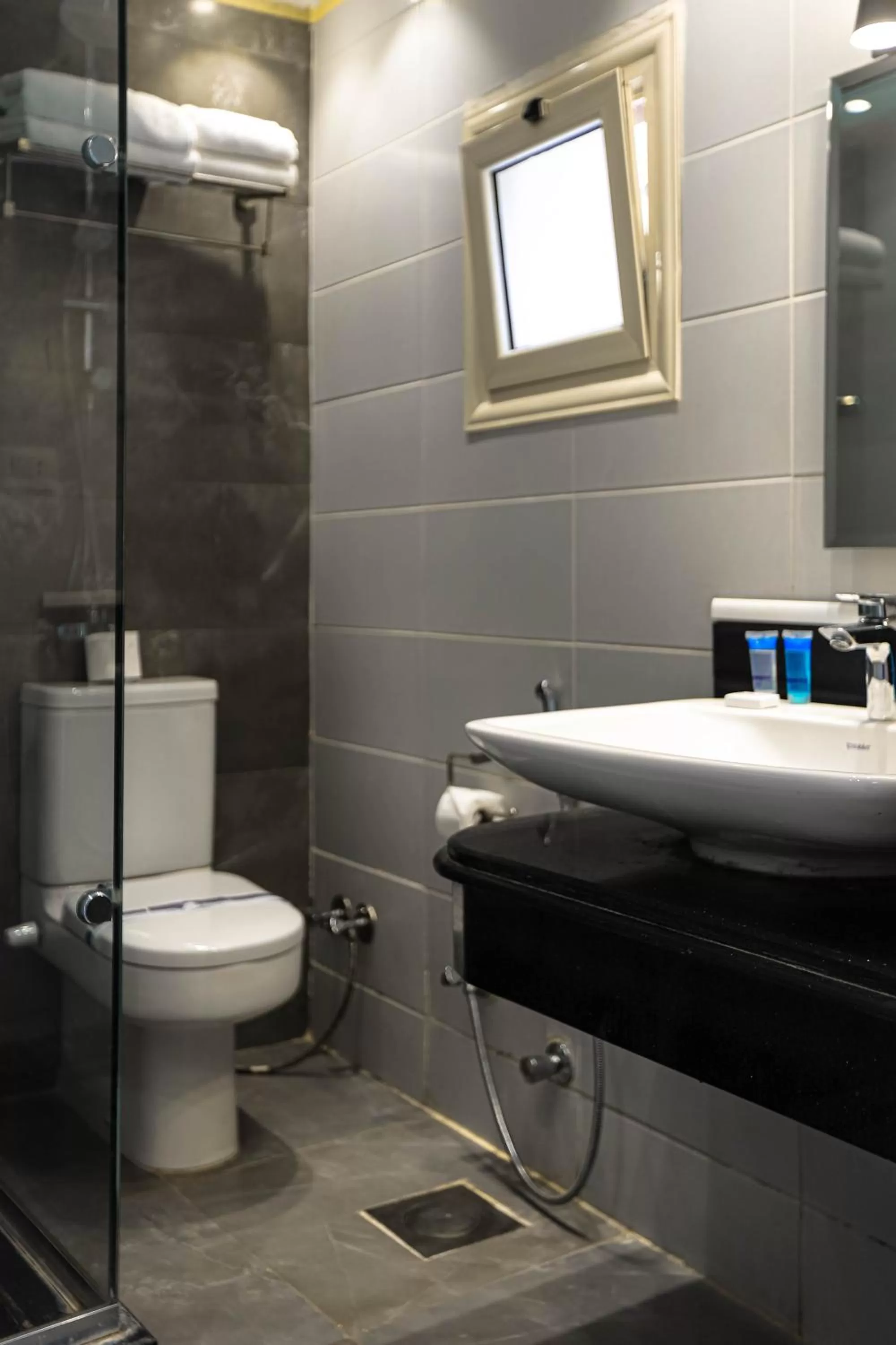 Bathroom in NewCity Hotel & Suites