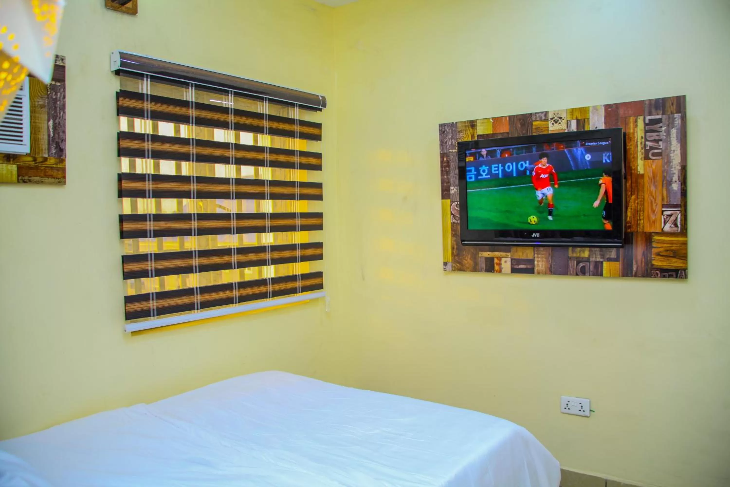 Bedroom, TV/Entertainment Center in ONTARIO SUITES