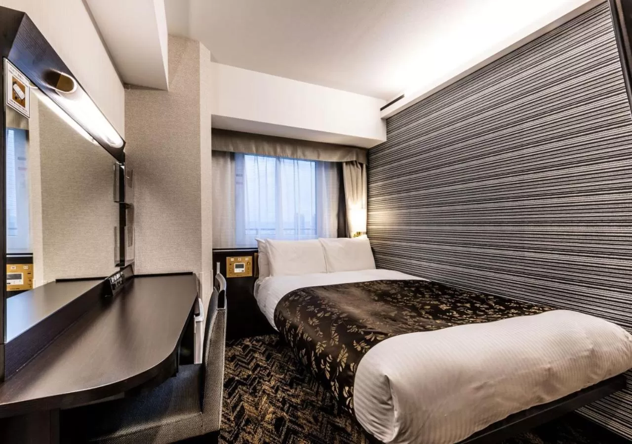 Photo of the whole room, Bed in APA Hotel & Resort Osaka Umeda Eki Tower