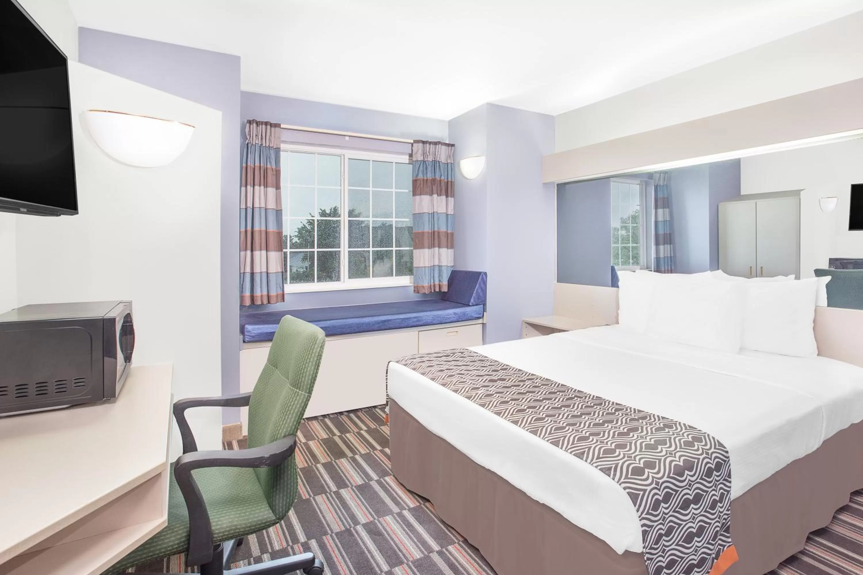 Living room, Bed in Microtel Inn and Suites by Wyndham Appleton