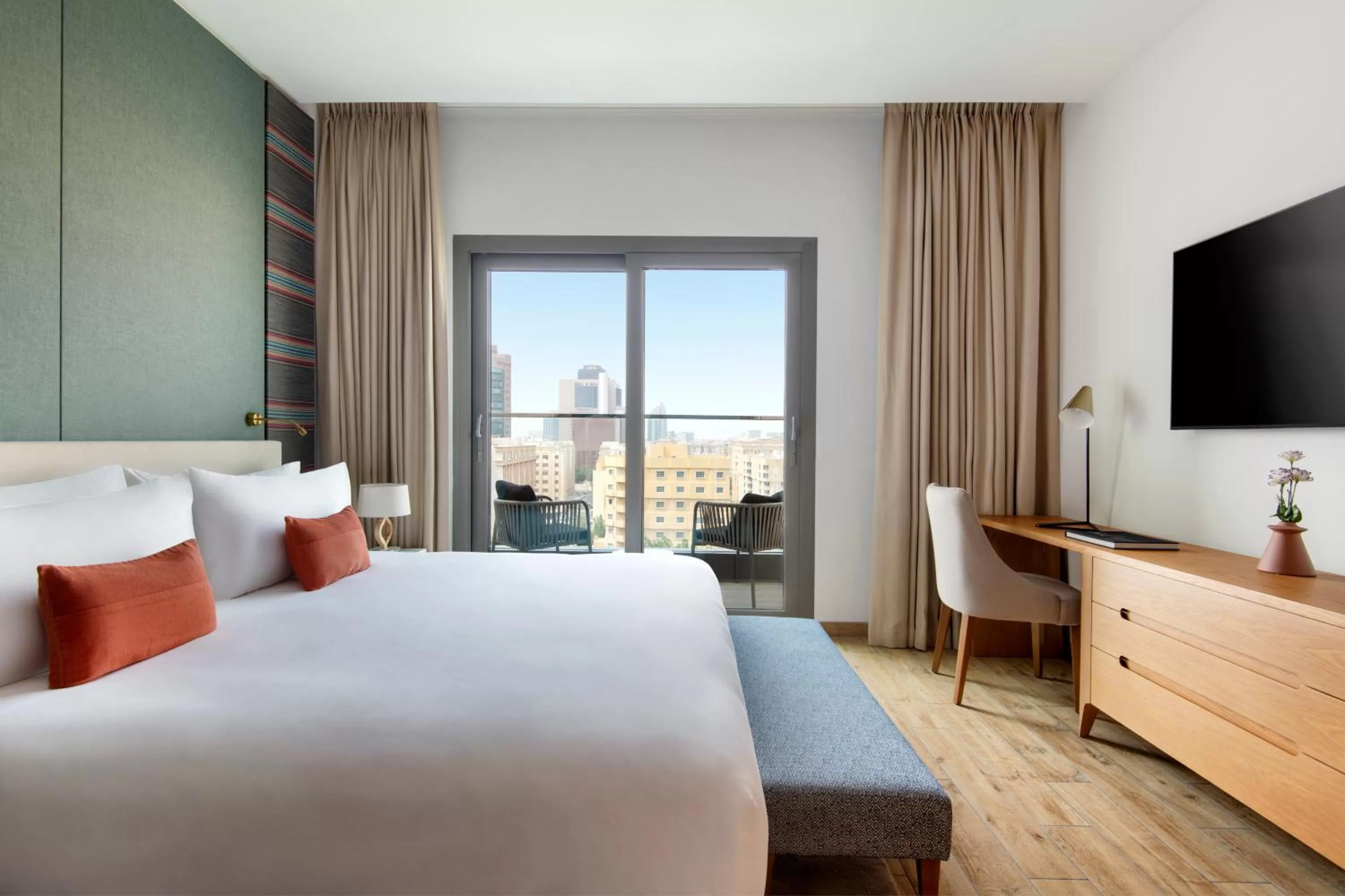 Communal lounge/ TV room, Bed in Abesq Doha Hotel and Residences, an IHG Hotel