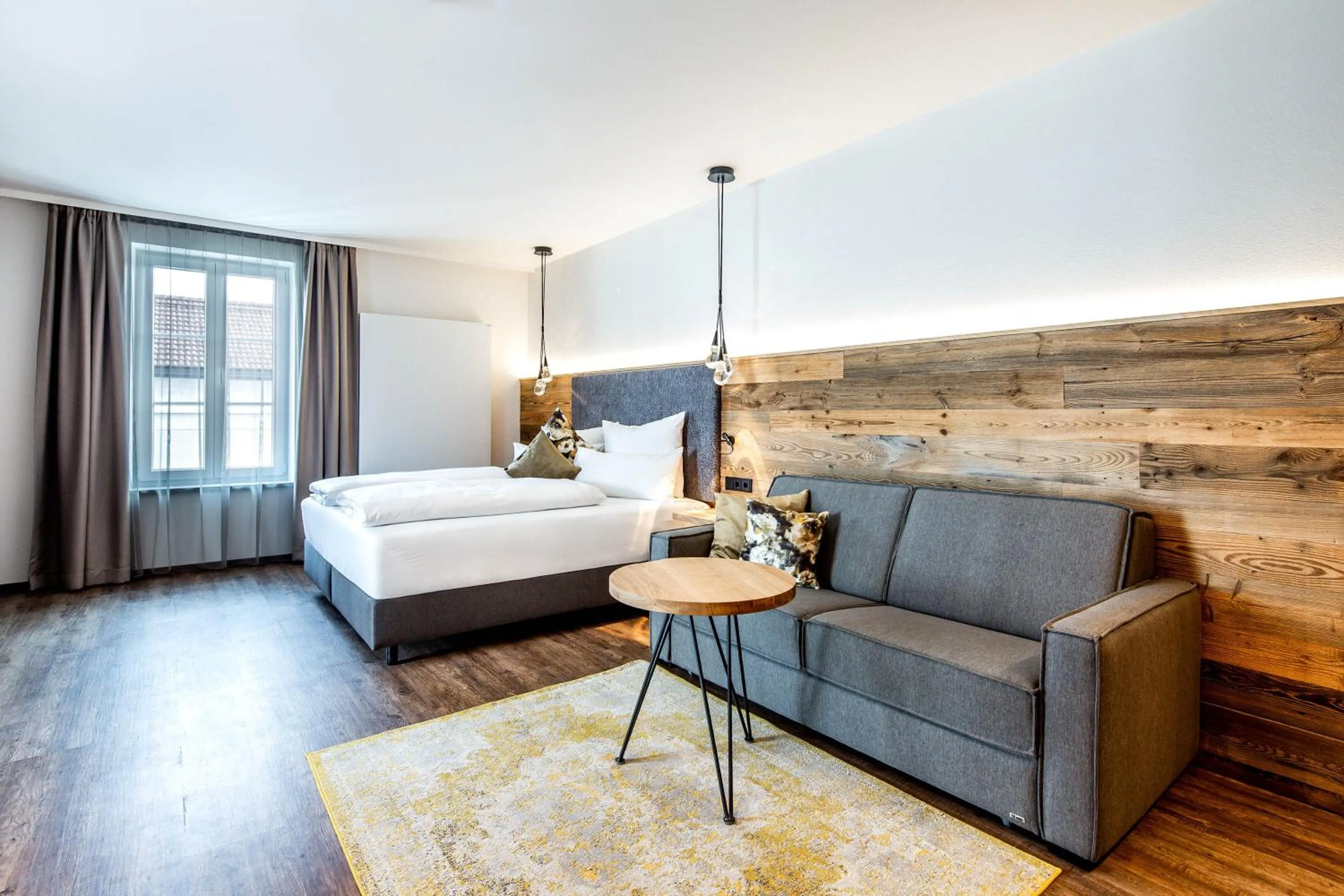 Seating area, Bed in Hotel Zum Stemplinger Hansl