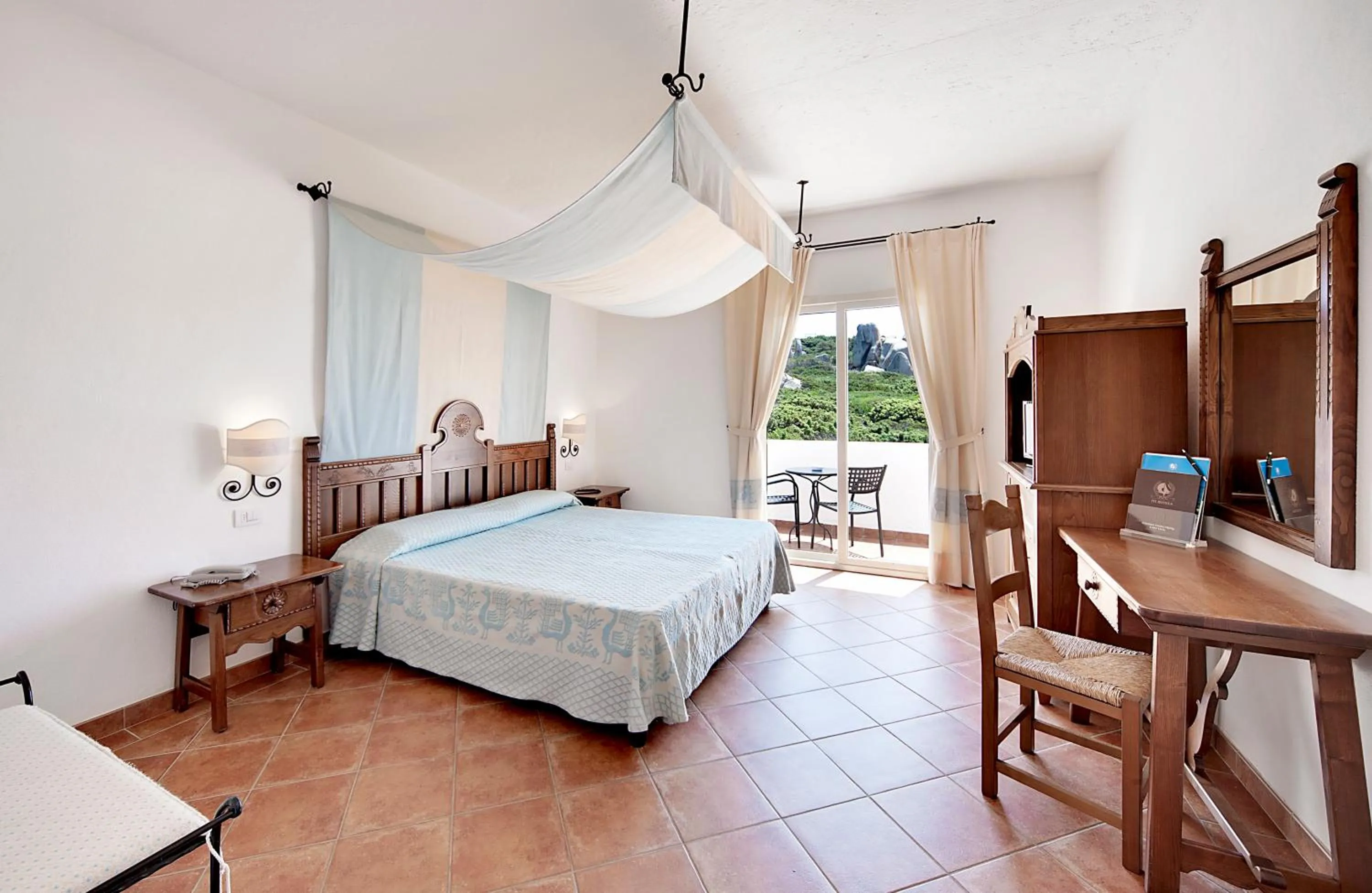 Photo of the whole room, Bed in COLONNA GRAND HOTEL CAPO TESTA, a Colonna Luxury Beach Hotel, Santa Teresa Sardegna