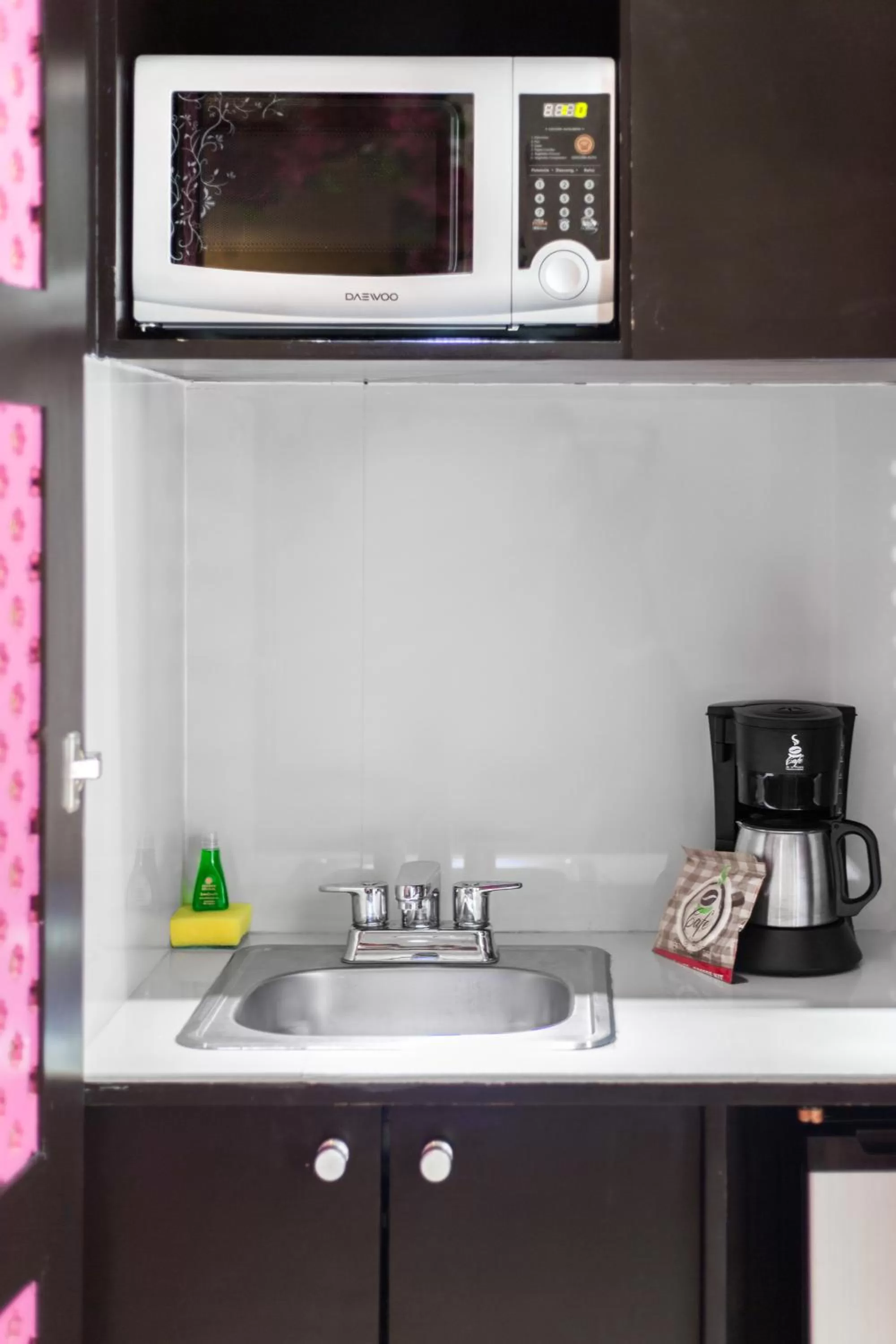 Kitchen or kitchenette in Suites Corazon