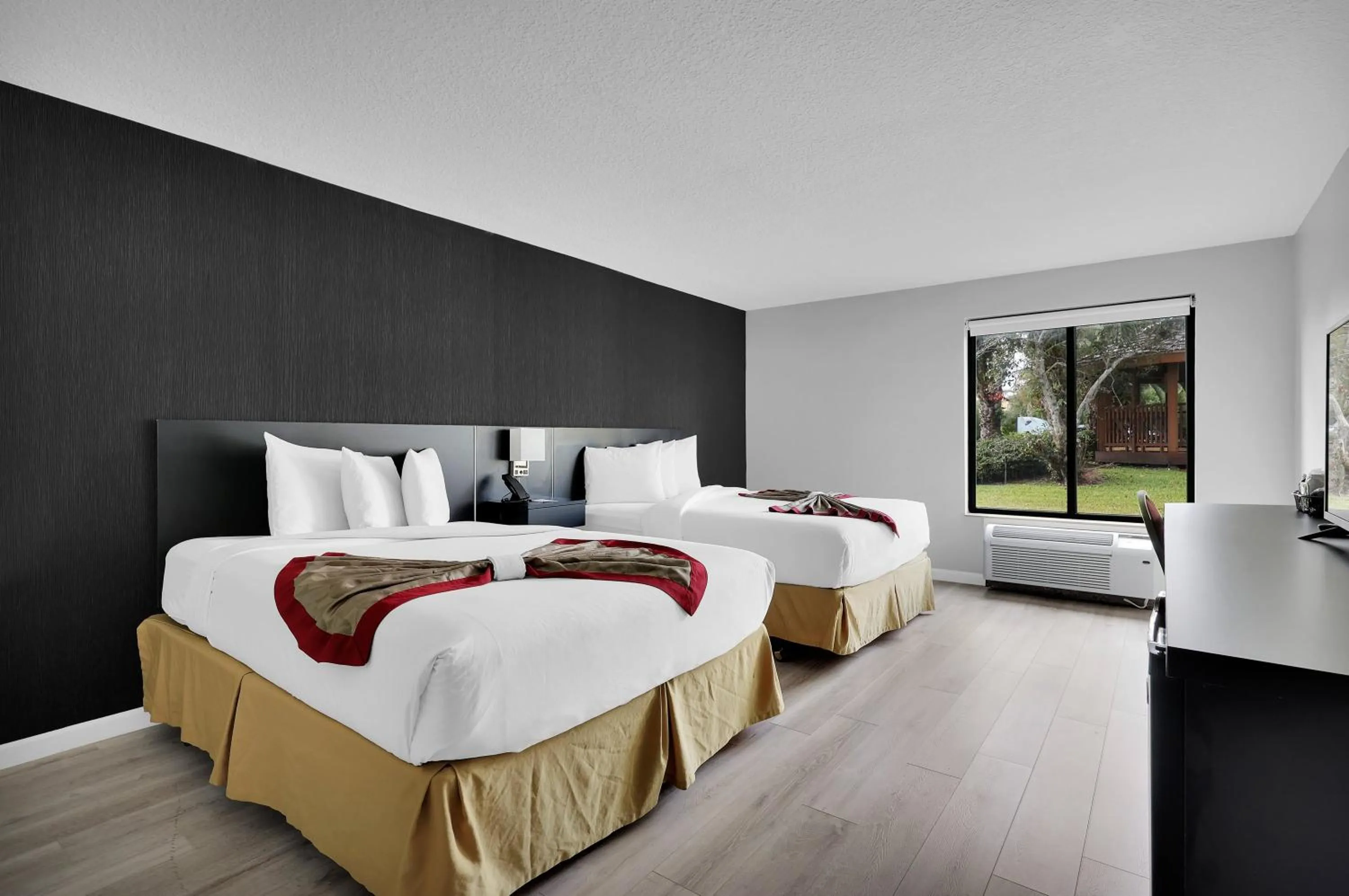 Bed in Ramada by Wyndham Jacksonville I-95 by Butler Blvd