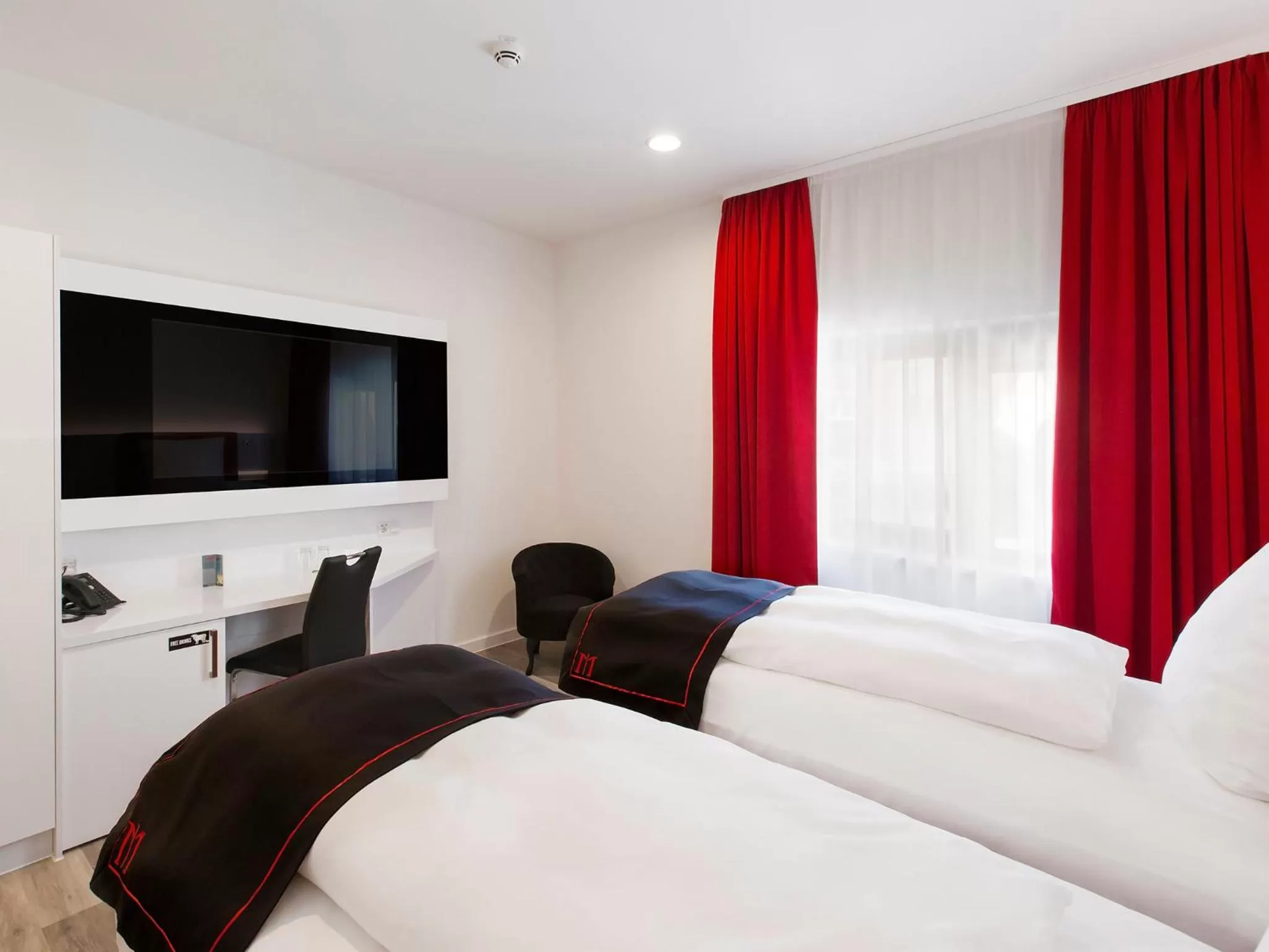 Bed in DORMERO Hotel Roth