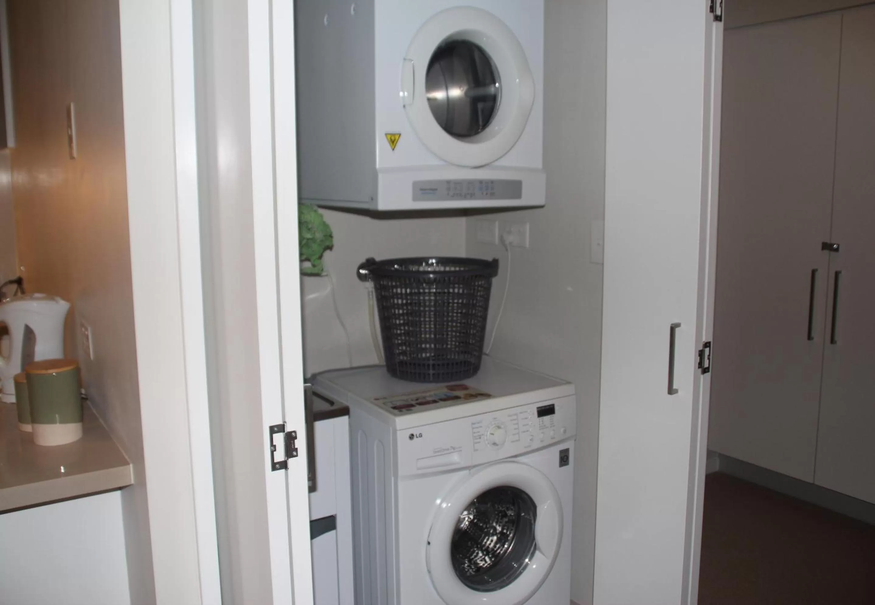 washing machine in Link Portside Wharf Apartment Hotel