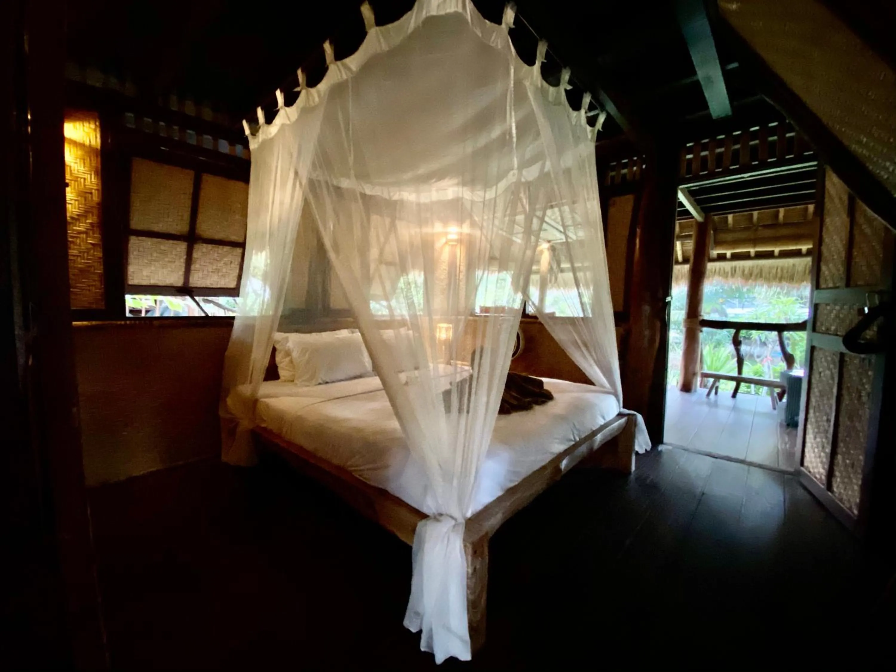 Bed in Flower Bud Bungalow Balangan