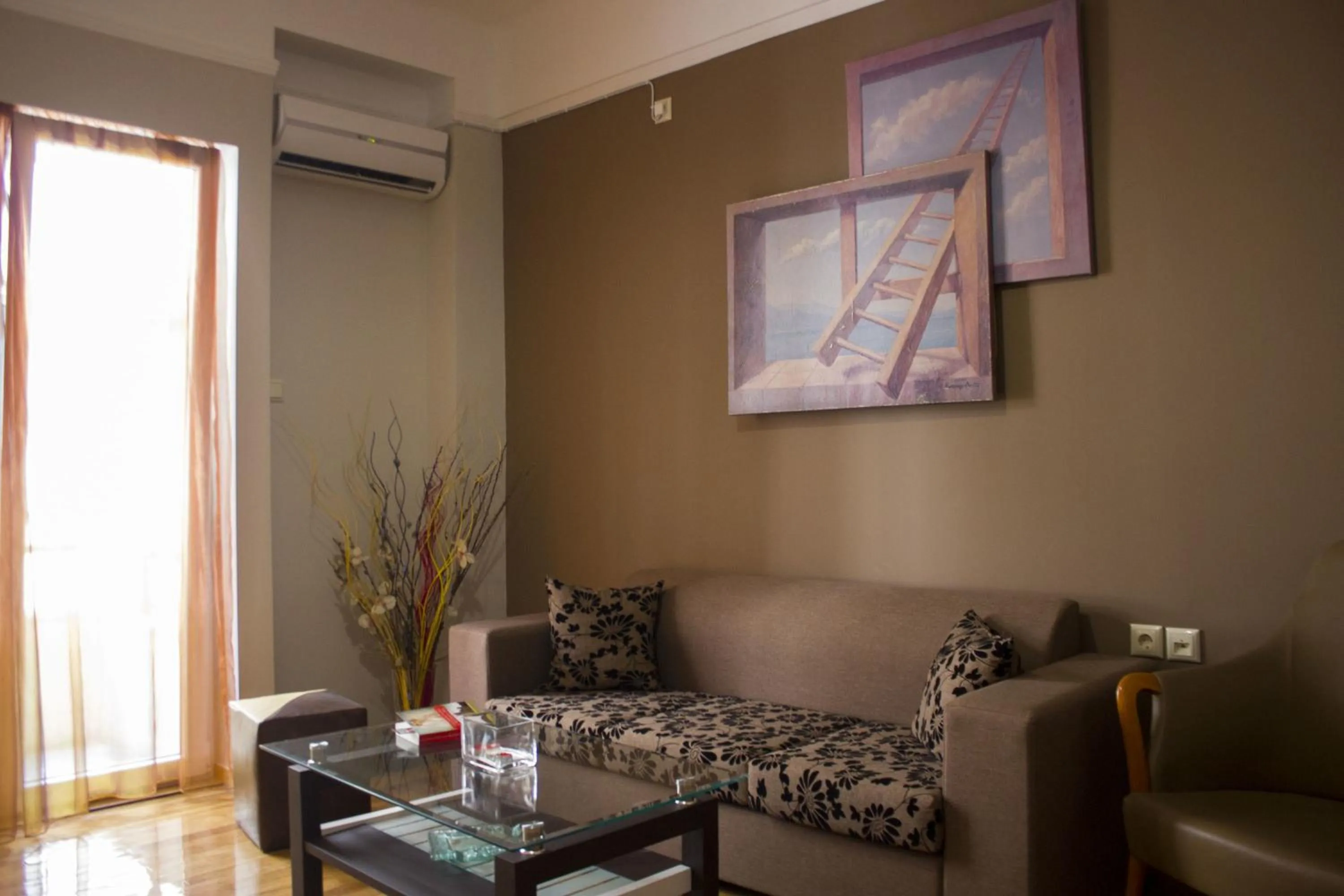 Communal lounge/ TV room in Ambrosia Suites