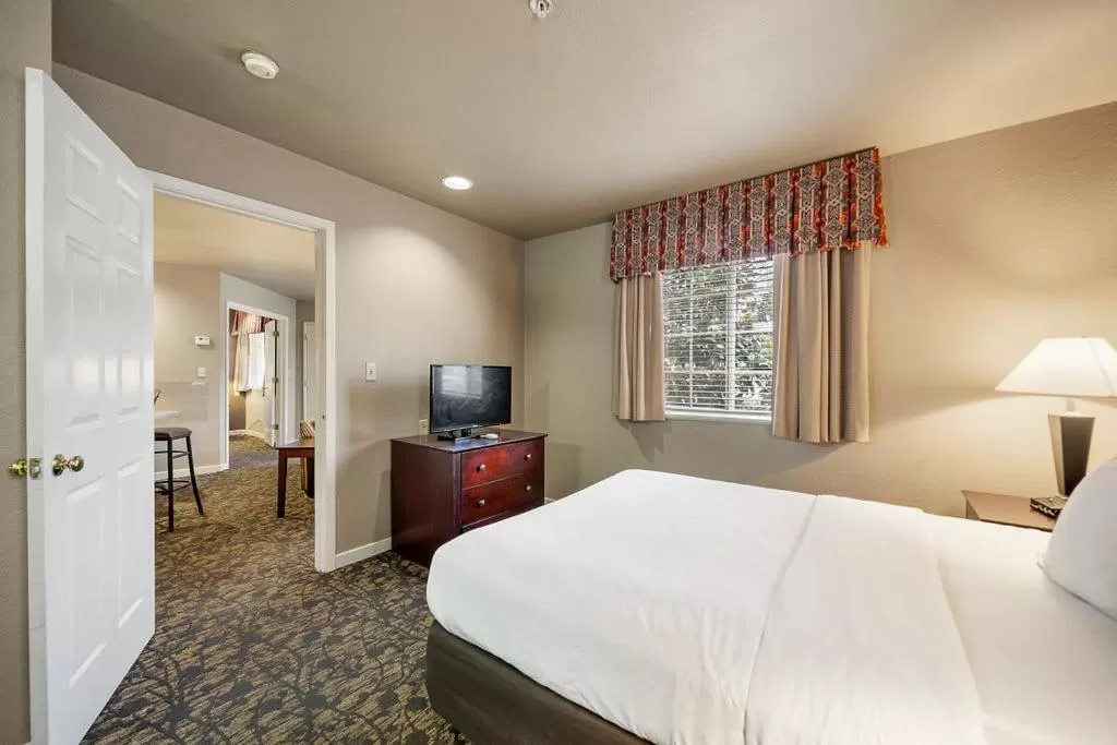 Bedroom, TV/Entertainment Center in The 505 Collection Buckhead