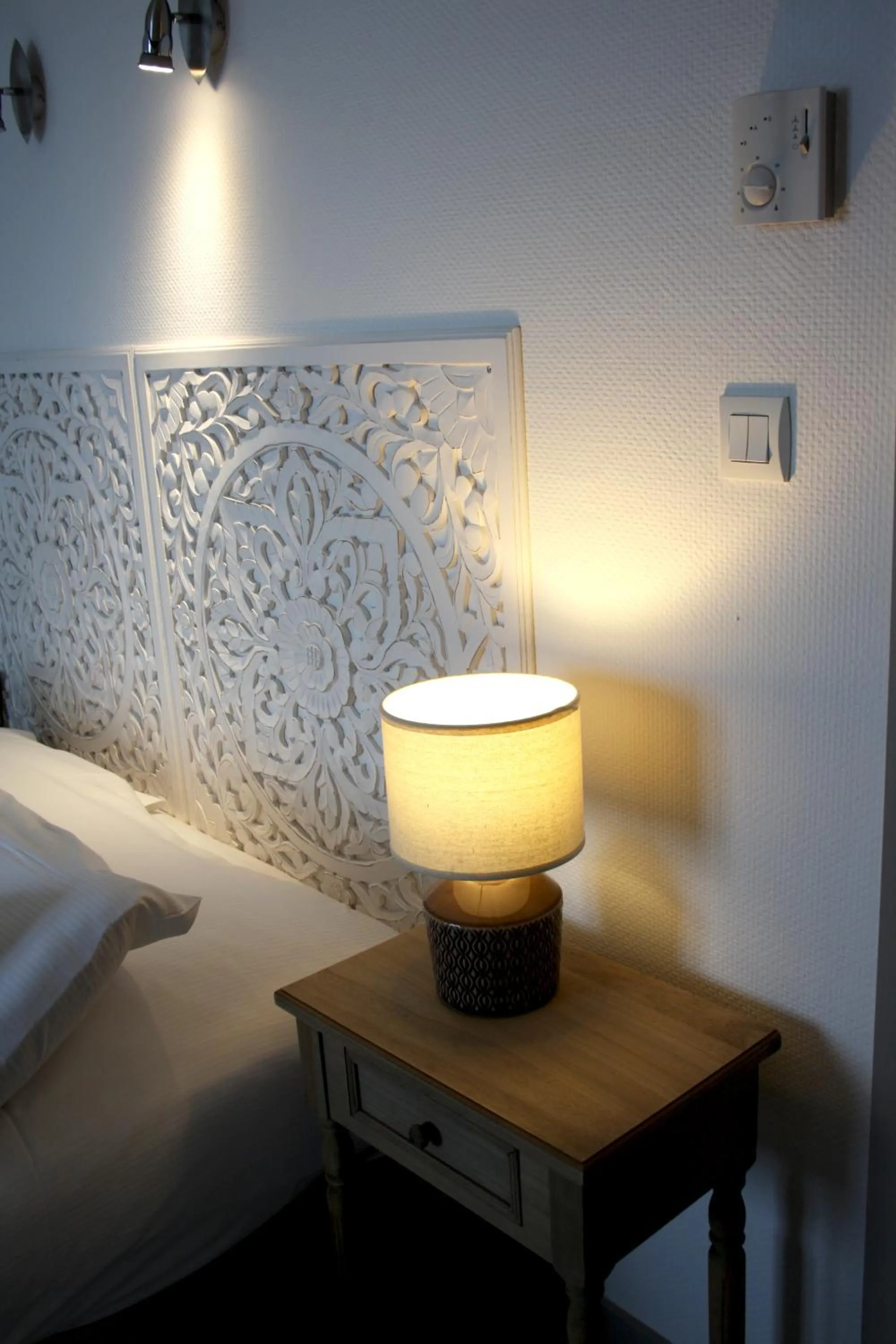 Bed in Logis Hôtel Sea View