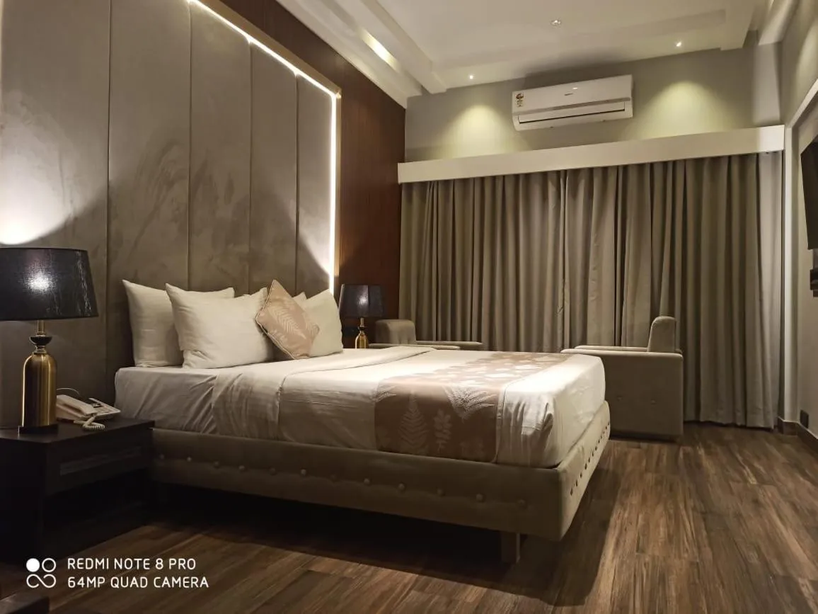 Bed in Hotel Poonja International