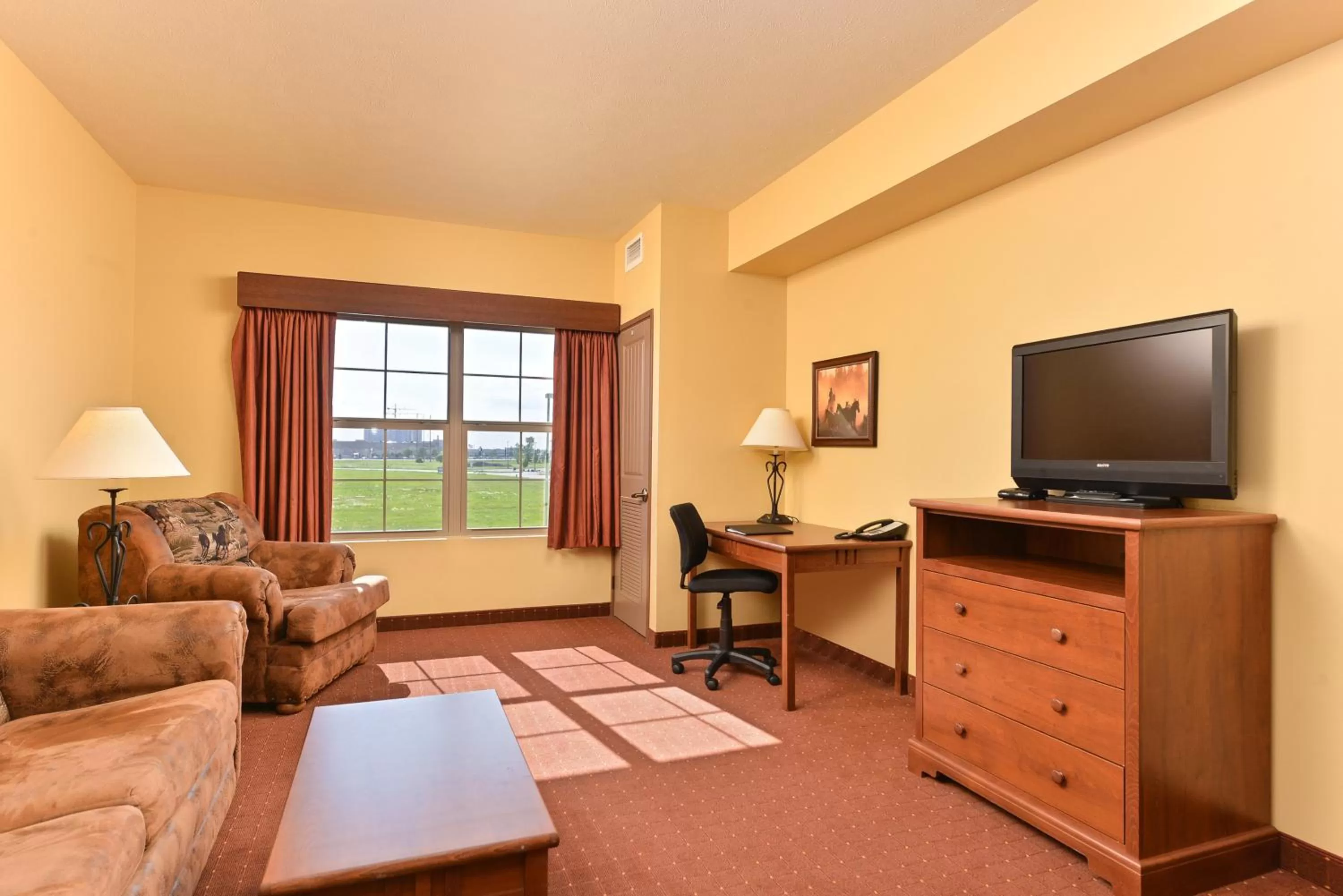 Living room in AmericInn by Wyndham Fargo Medical Center