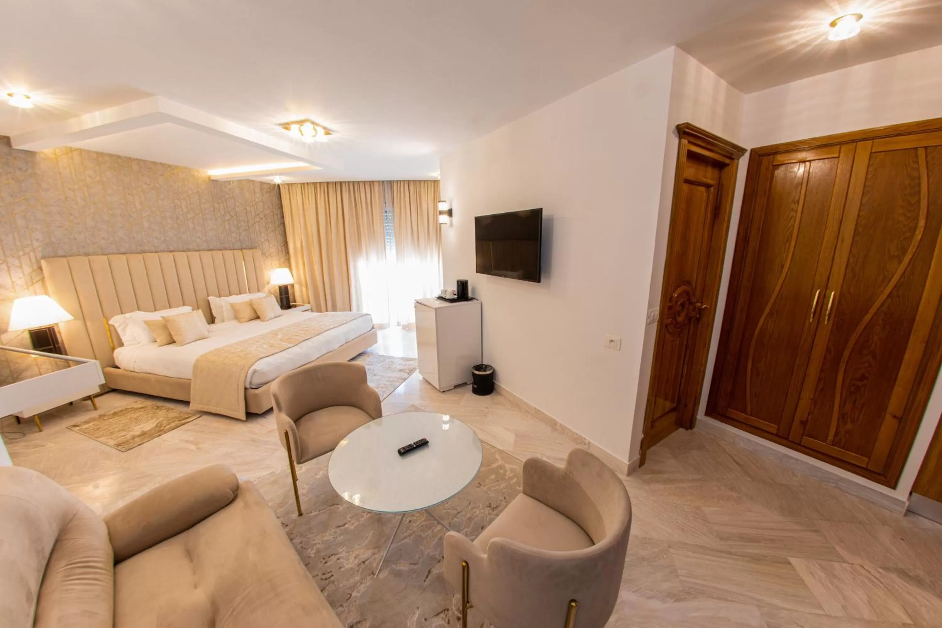 Communal lounge/ TV room, Bed in The Penthouse Suites Hotel