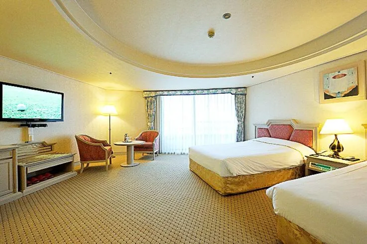 Bed in Jeju Pacific Hotel