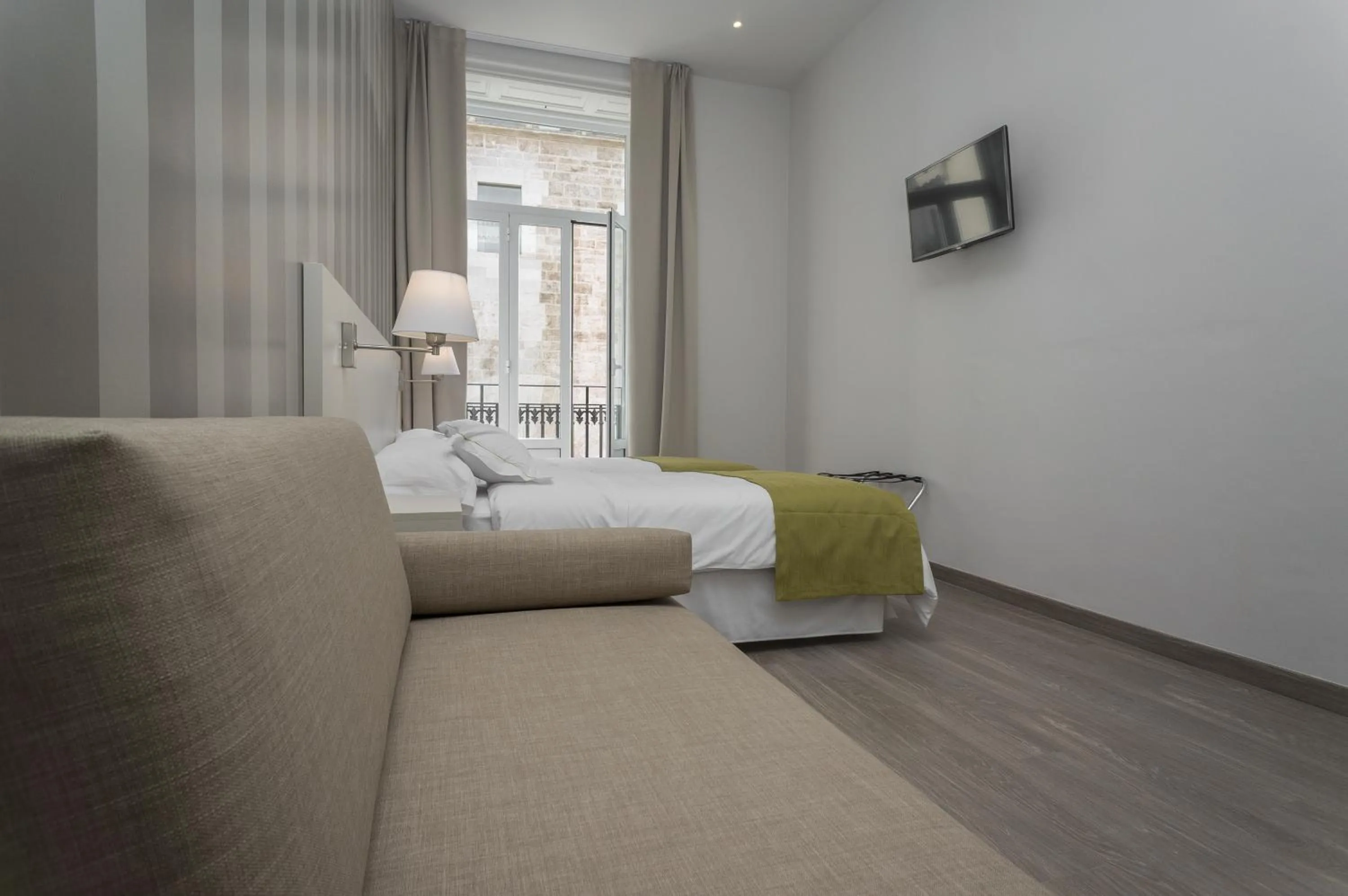 Bed in Hotel San Lorenzo Boutique Plaza