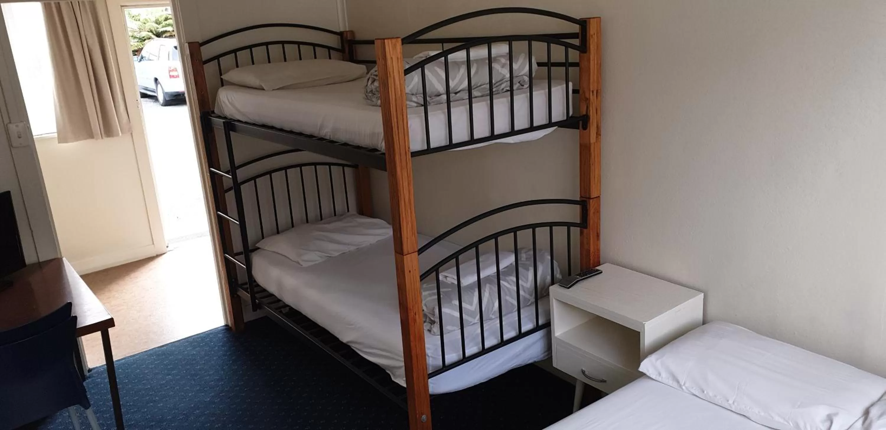 Bed in Camellia Court Family Motel