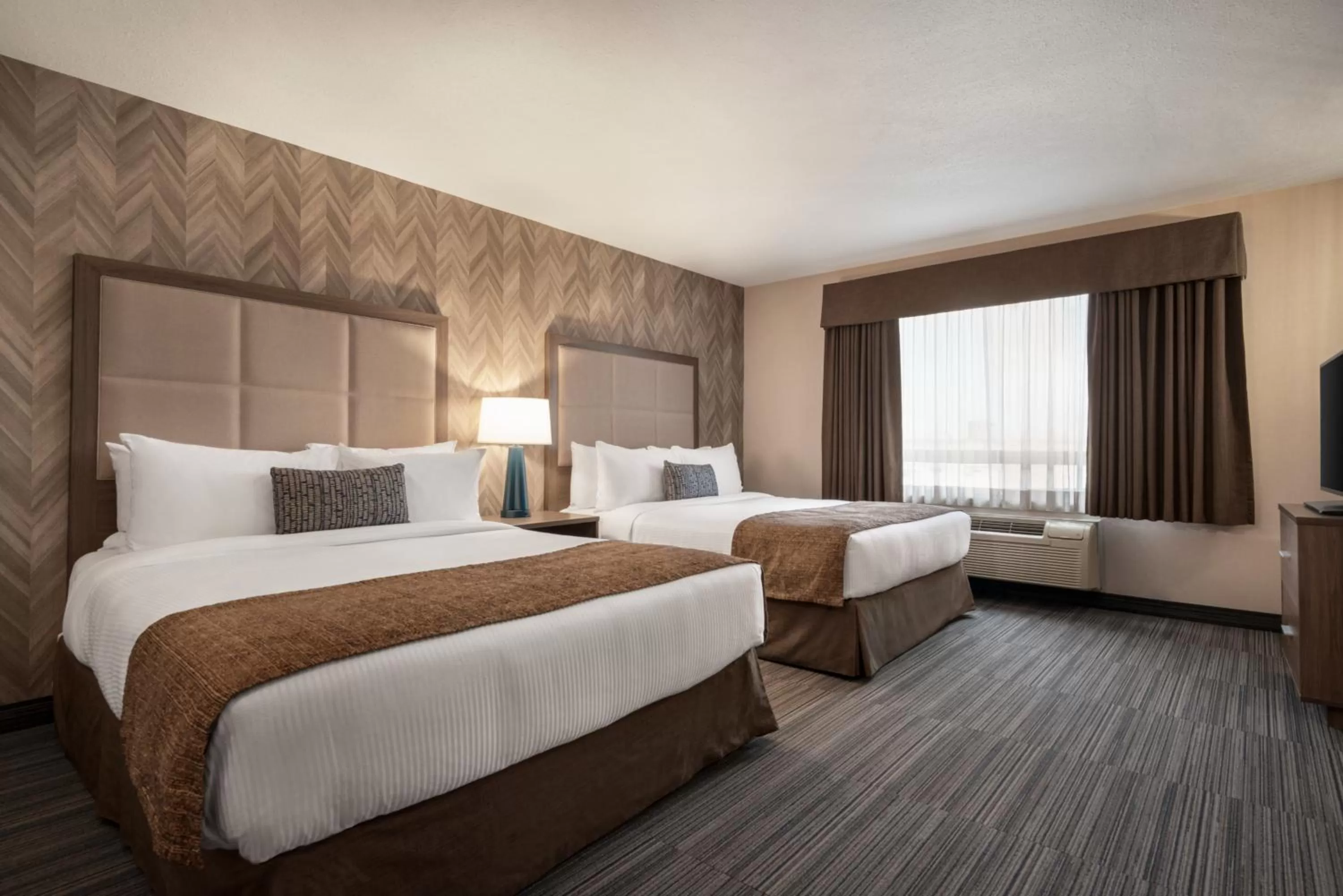 Bedroom, Bed in Ramada by Wyndham Airdrie Hotel & Suites