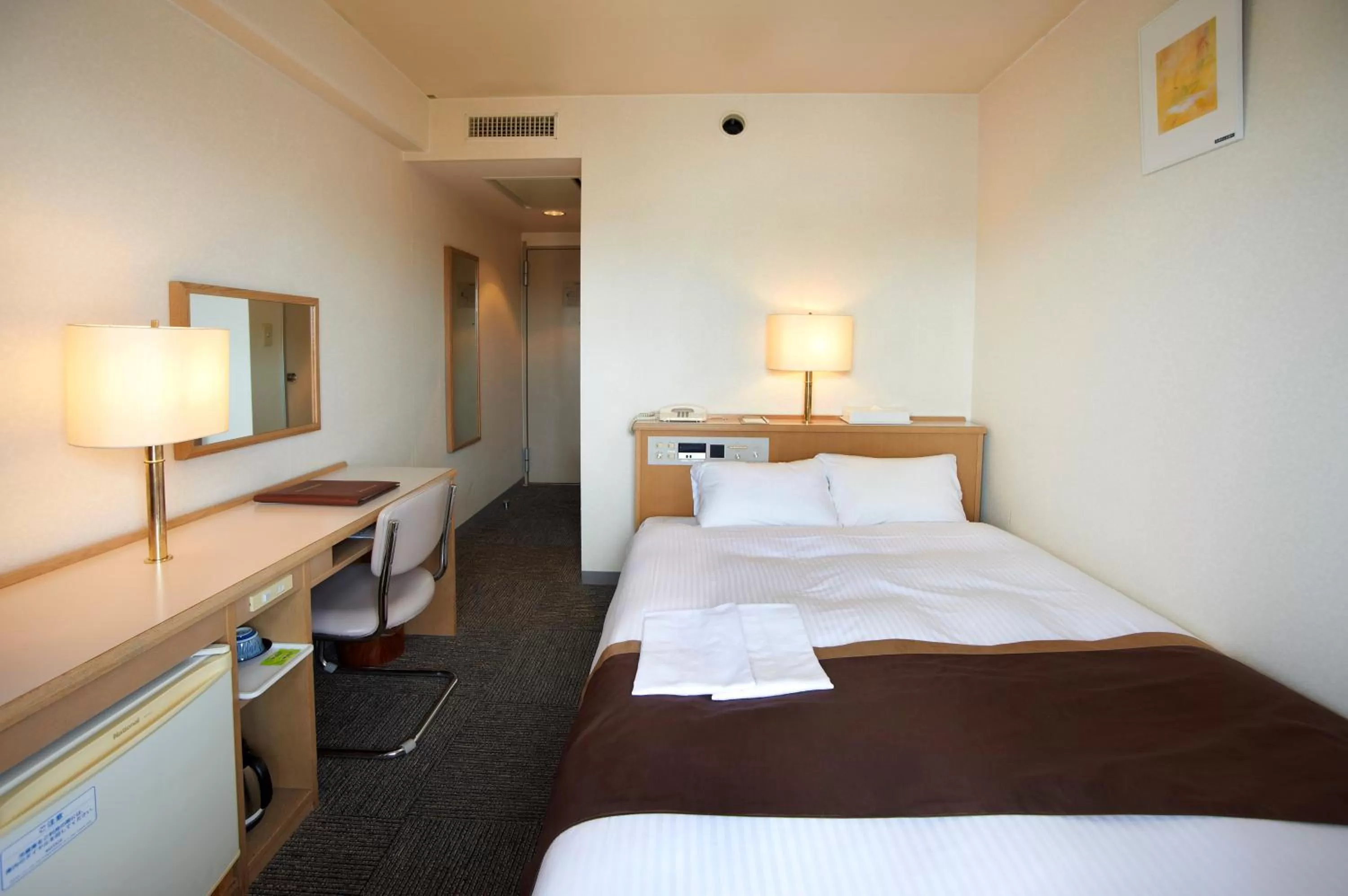 Bed in Shin-Osaka Sunny Stone Hotel