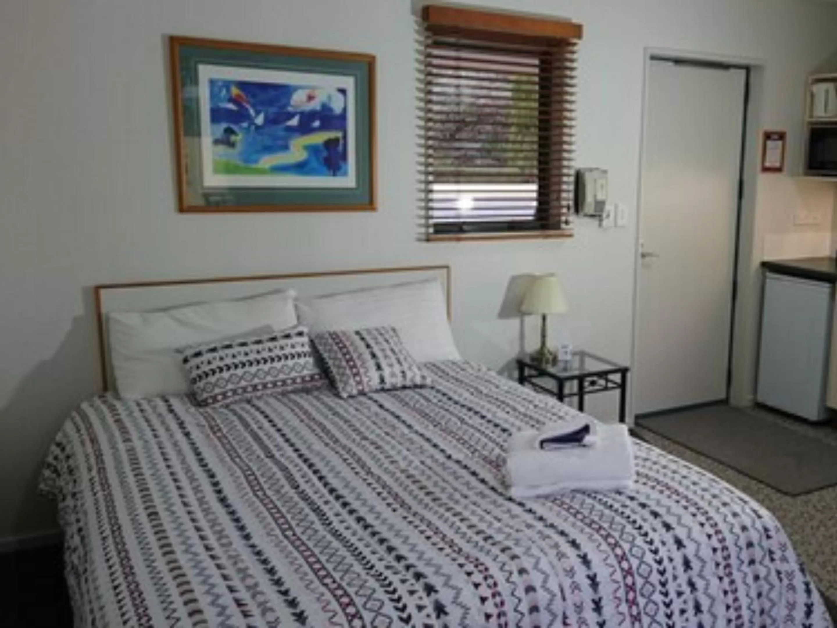 Bed in Tuscany Gardens Motor Lodge