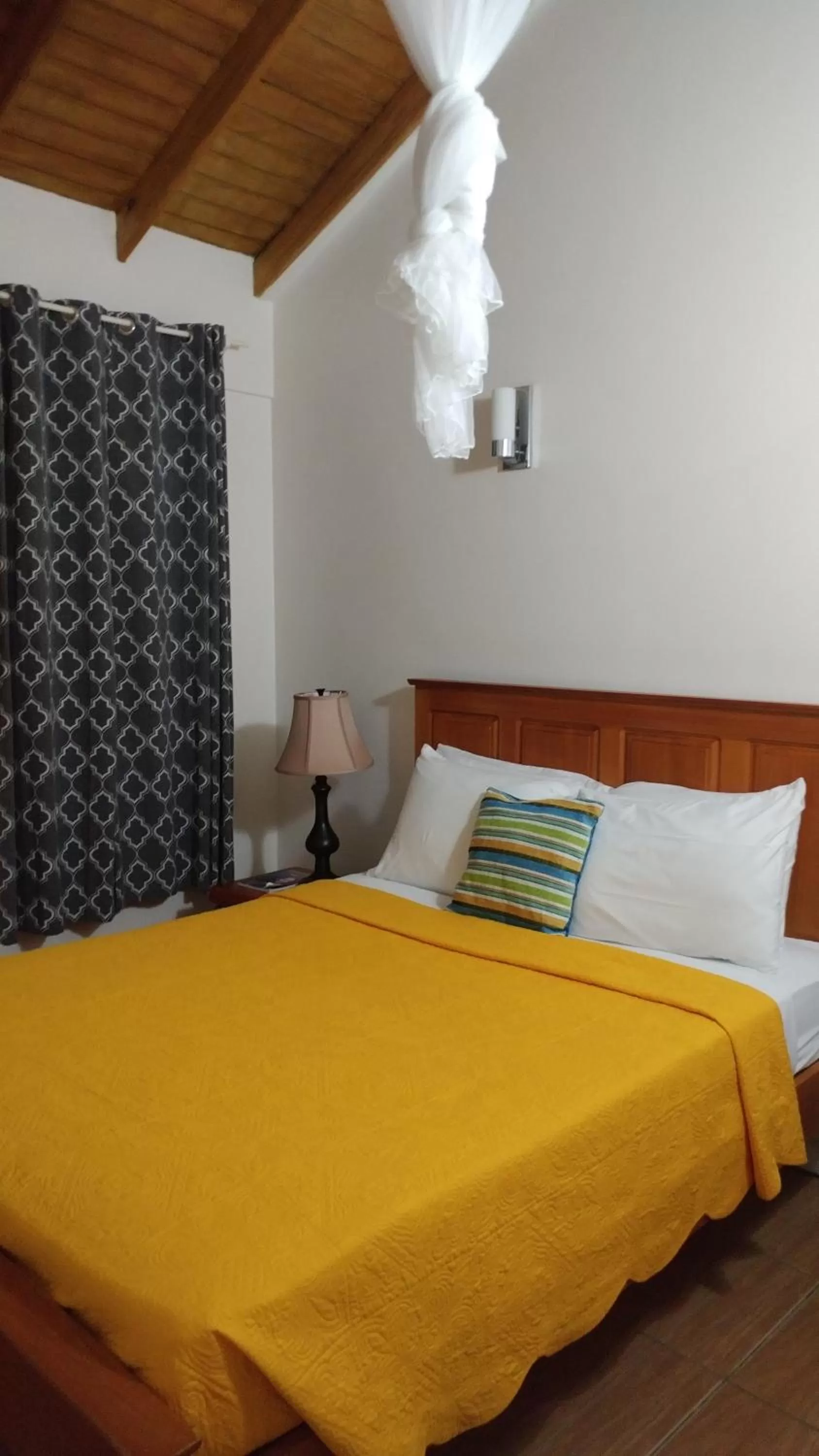 Bed in Classique International in Dominica