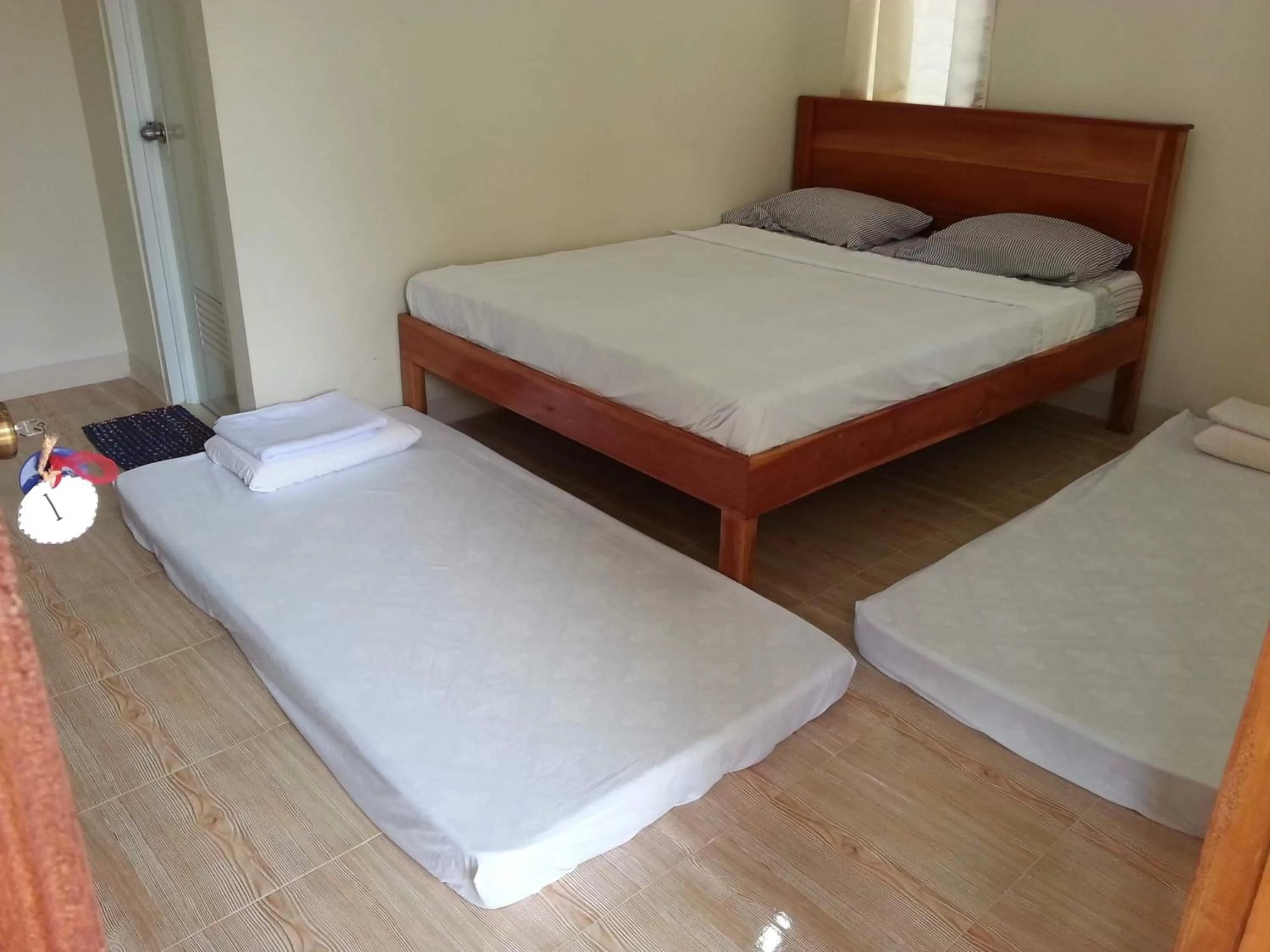 Bed in D's Oceanview Beach Resort