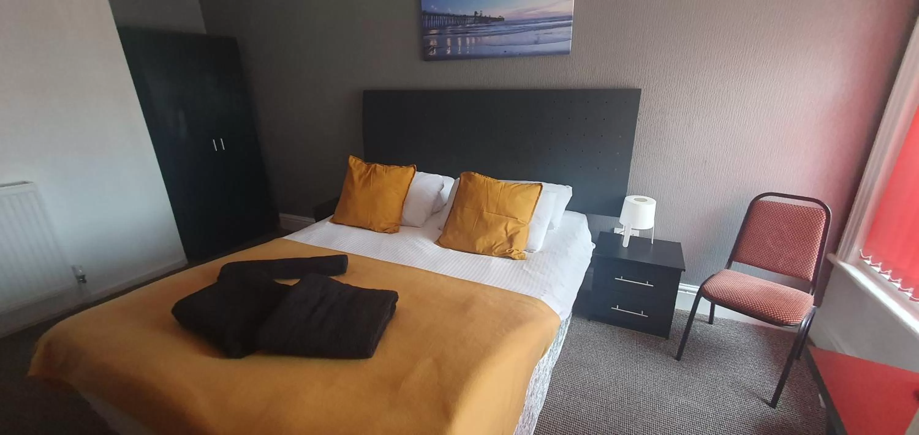 Bed in Palm Beach Hotel by the Sea