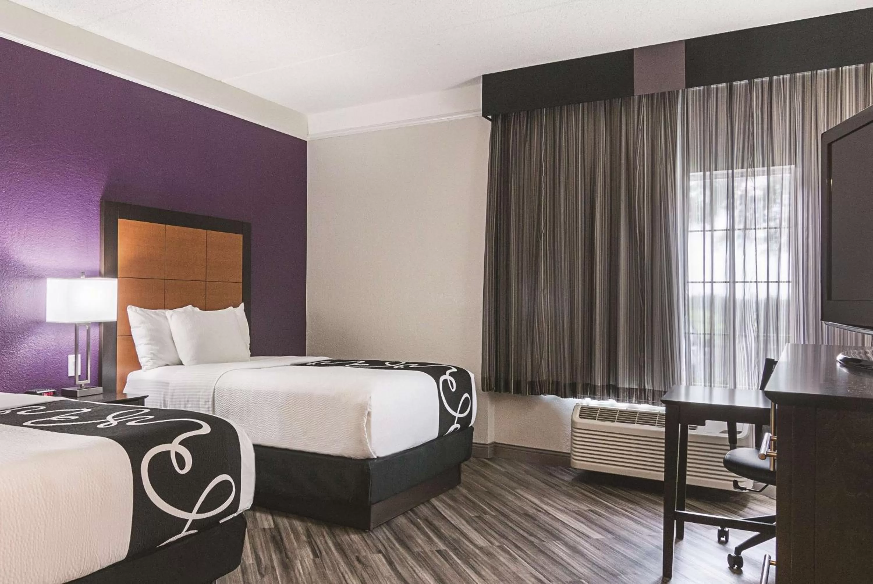 Photo of the whole room, Bed in La Quinta by Wyndham Orlando Airport North - Free Airport Shuttle!